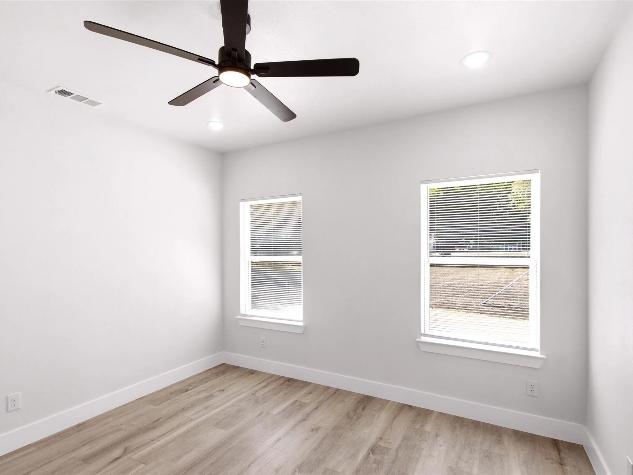 Wood-finish flooring, recessed lighting, and a ceiling fan