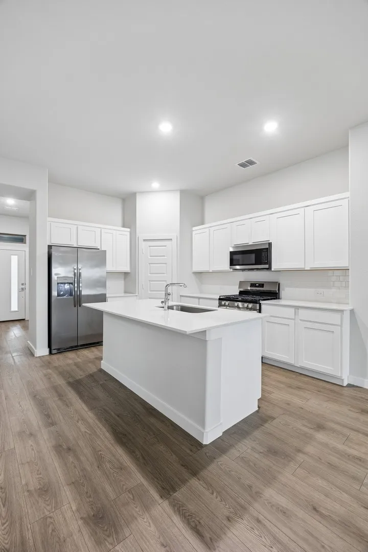 Kitchen in the Cedar home plan – REPRESENTATIVE PHOTO