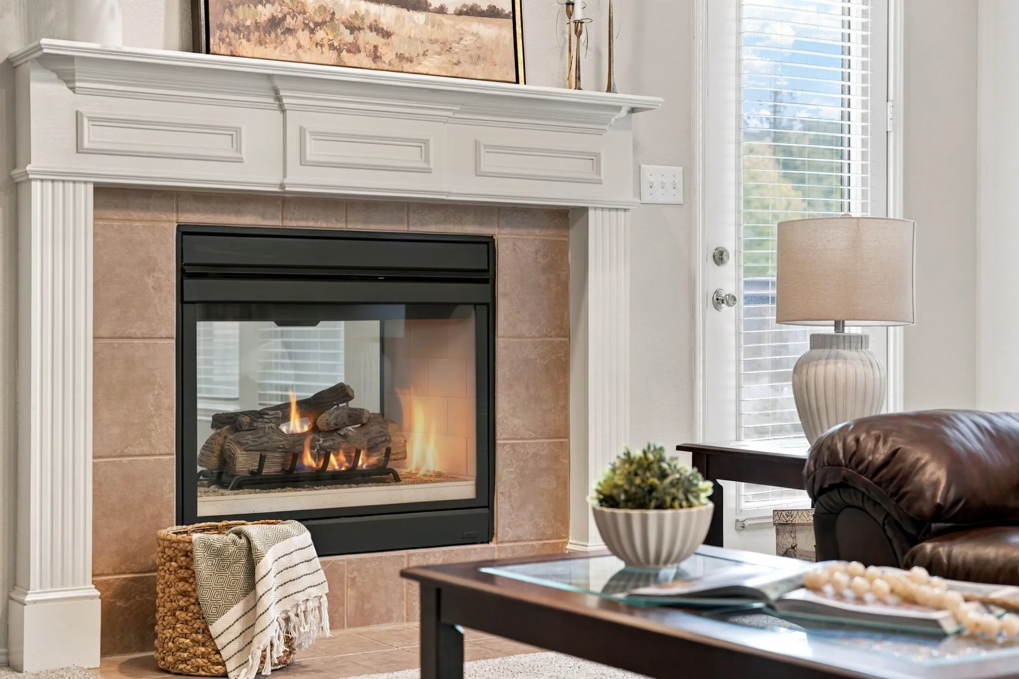 Double Sided glass front gas fireplace welcome you into the home. Flip it on with a Switch!