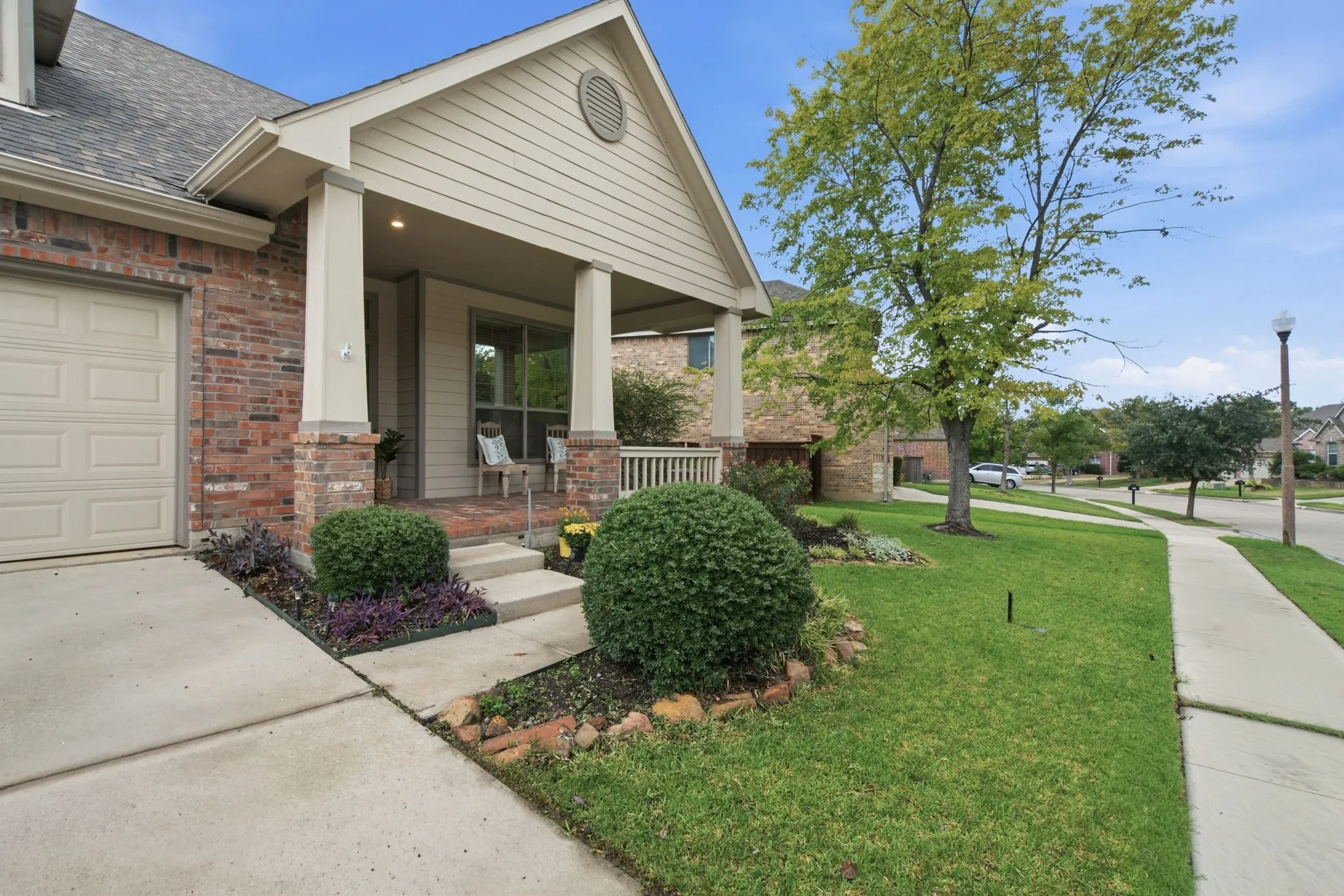 Sit on your front porch enjoying the day on this quiet street of Pecan Creek.