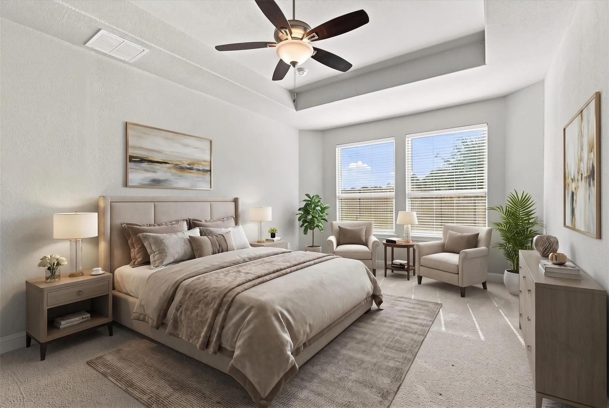 Bright primary bedroom featuring a coffered ceiling, and ample space for a sitting area. (virtually staged photo)