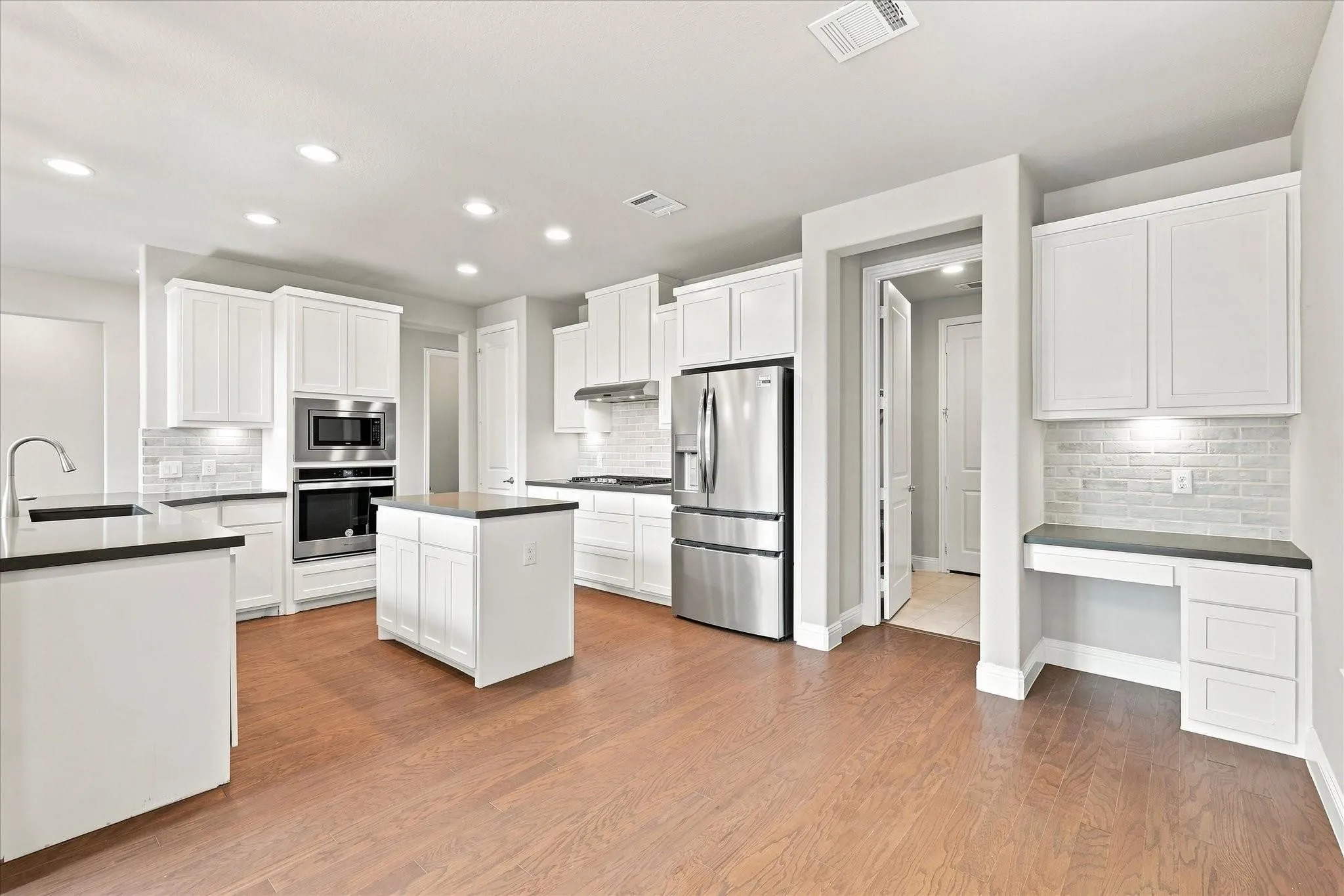 Adjacent to kitchen is the popular command center.