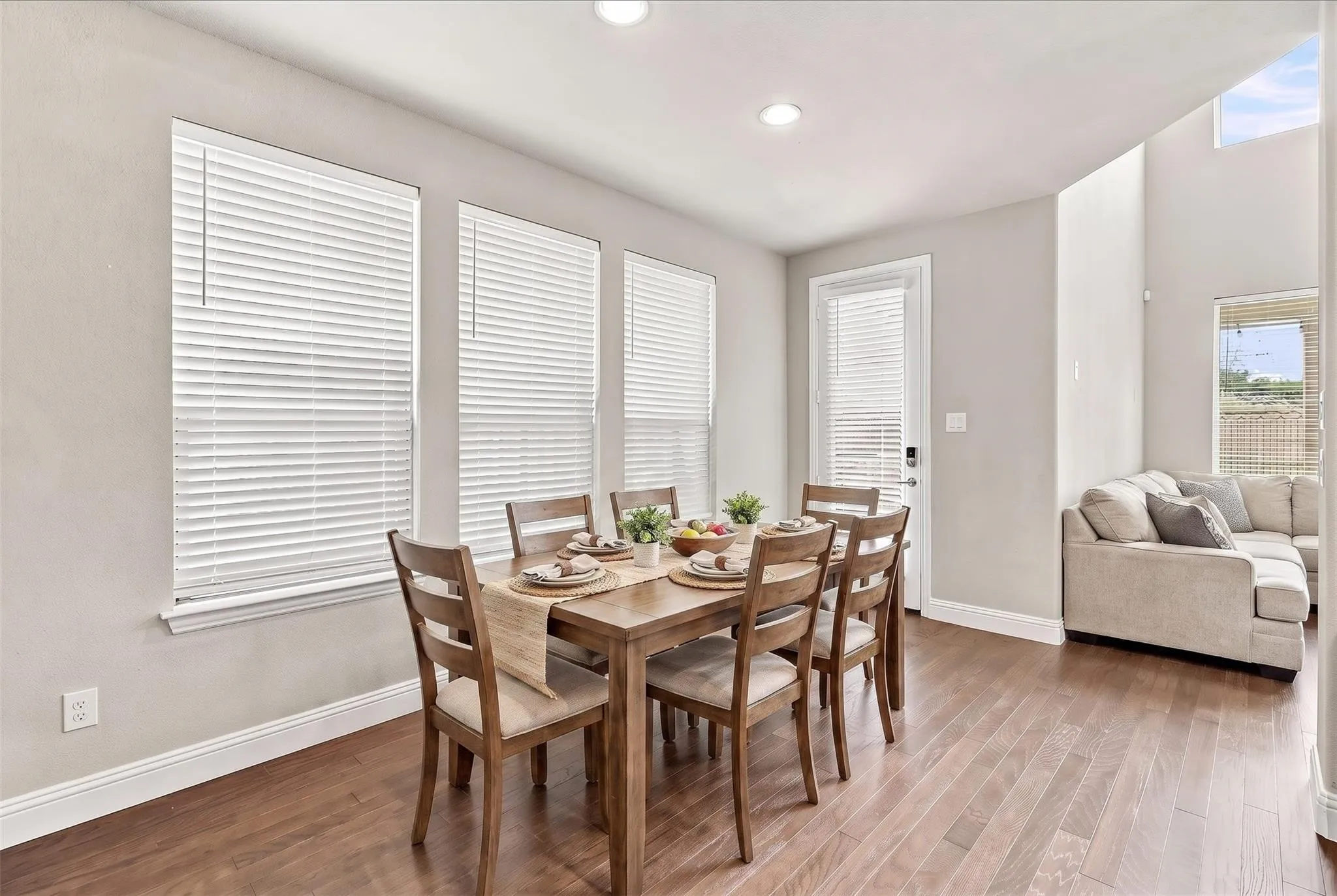 Dining nook adjacent to kitchen for easy living! (virtually staged photo)