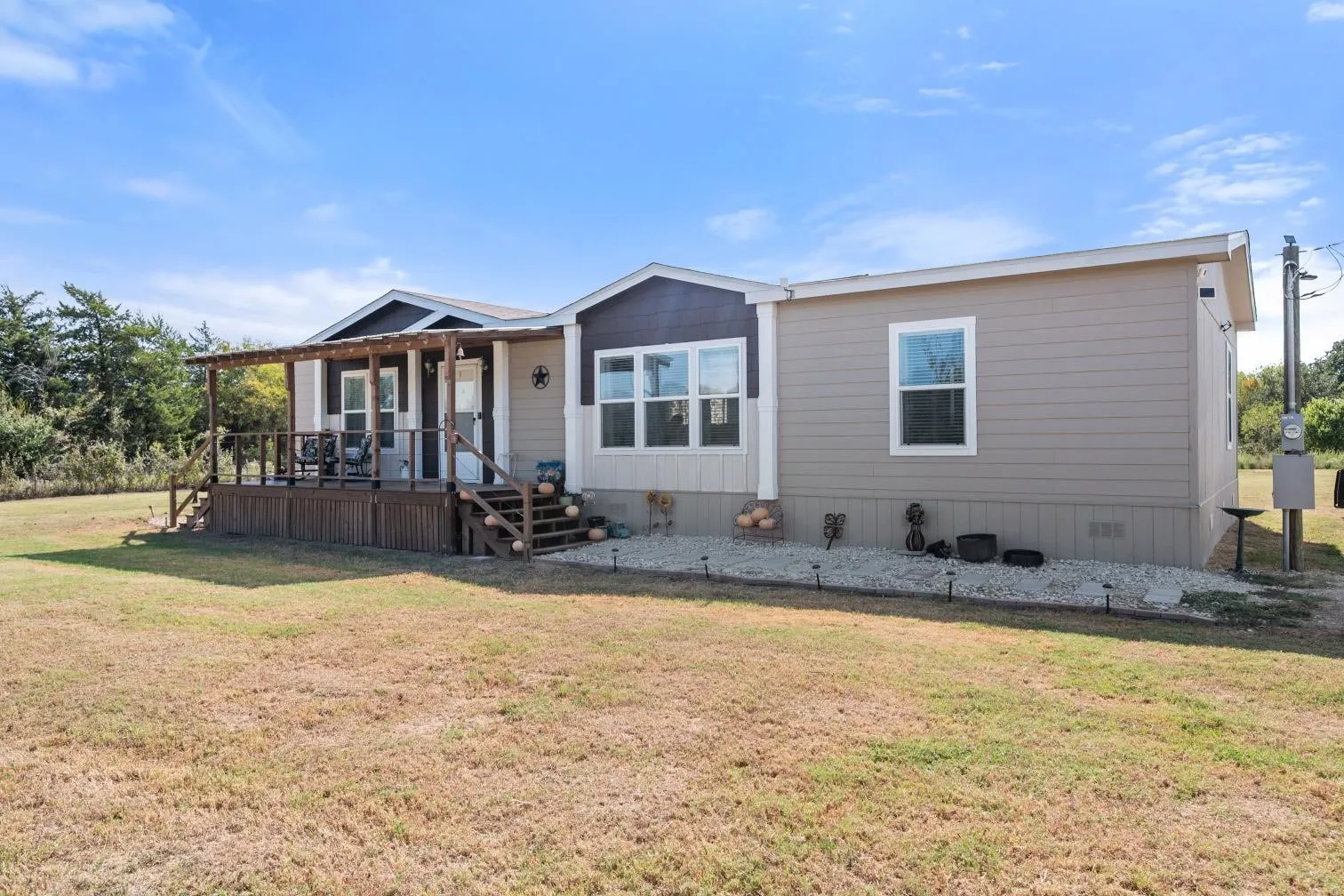 Expansive covered wood deck with railed entry