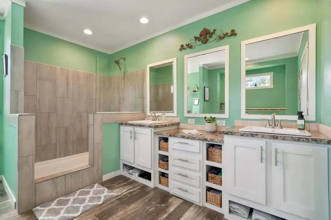 Walk-in shower with tiled walls and glass enclosure