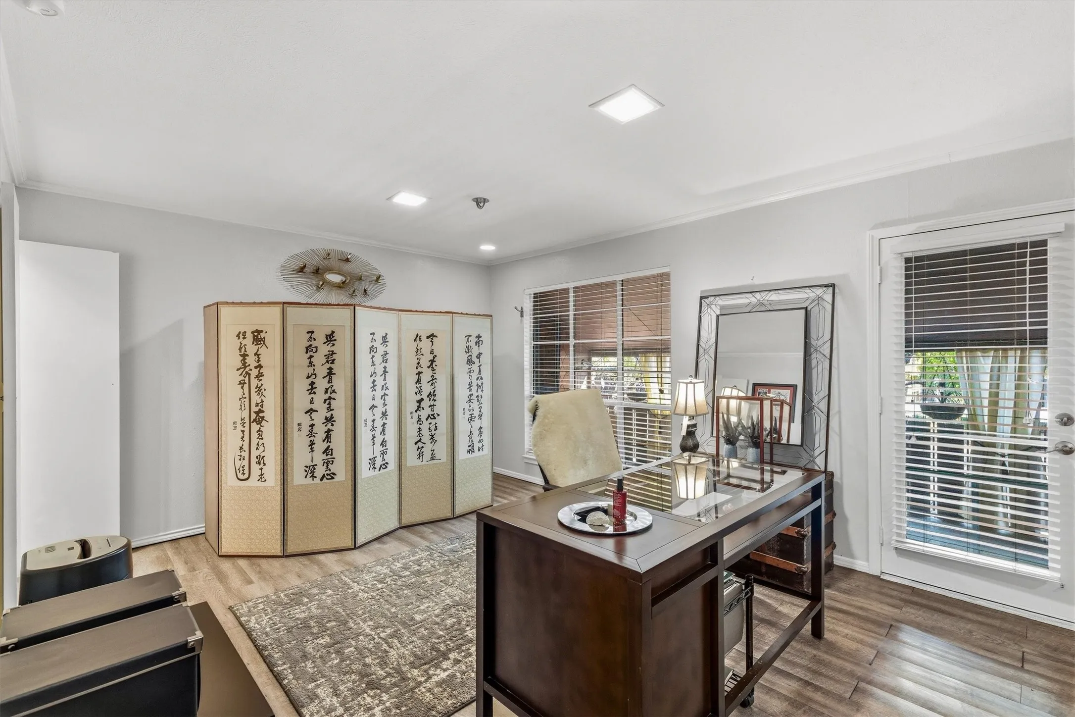 Wood-finish flooring, recessed lighting, and a white ceiling