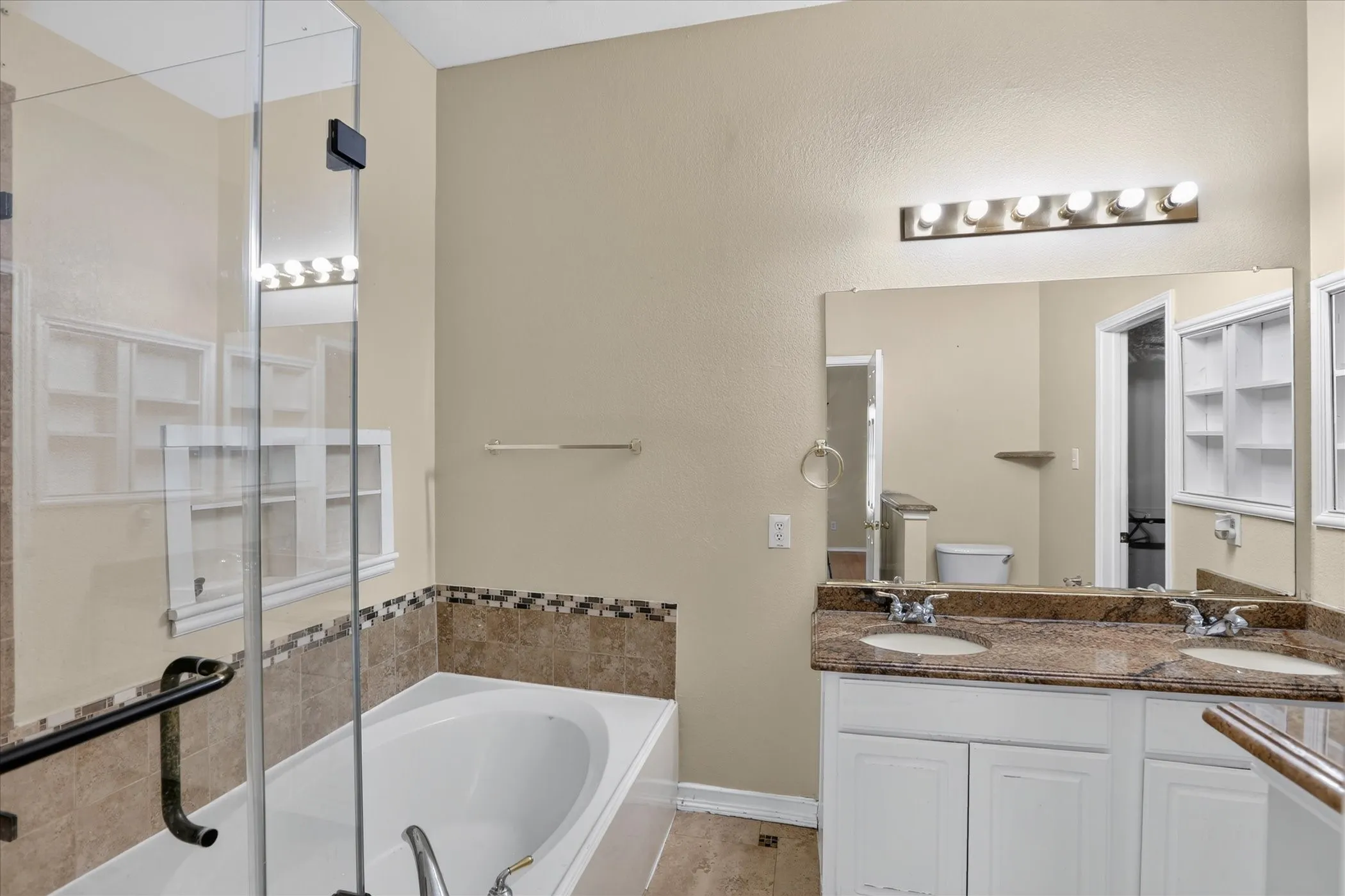 Dual vanity with undermount sinks and stone countertops