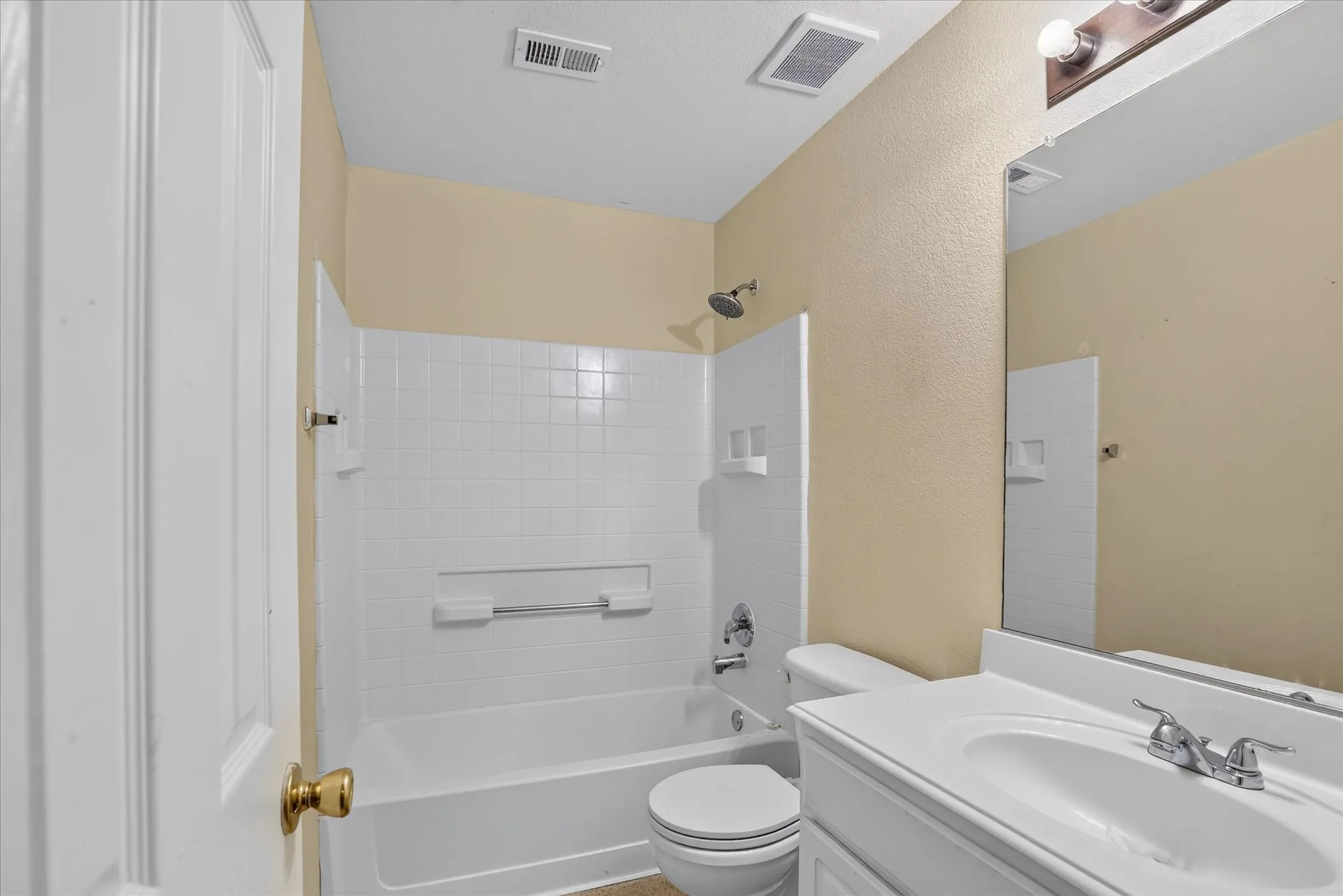 White vanity with an integrated sink and chrome faucet