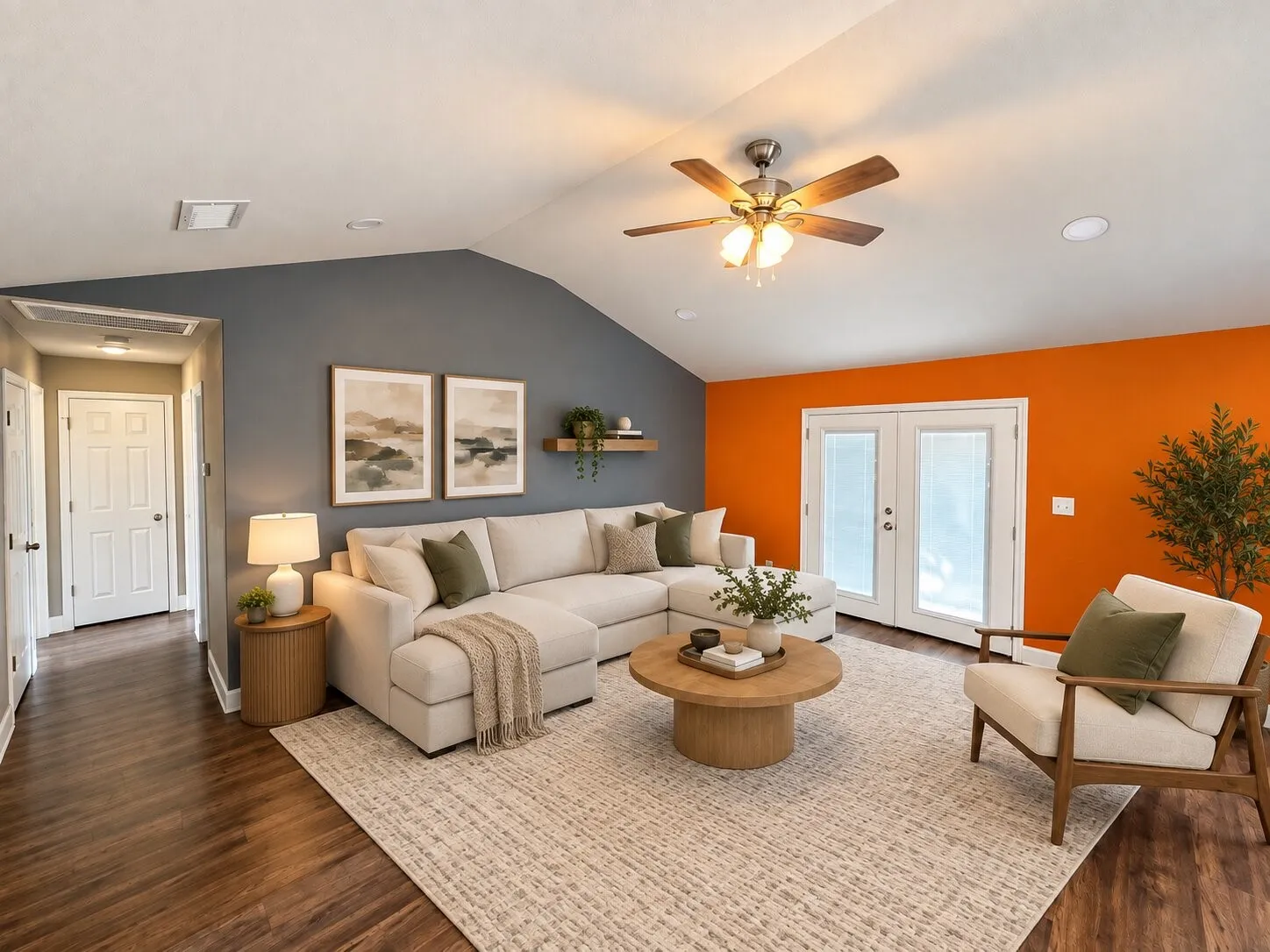 Virtually staged -
Vaulted ceiling featuring a ceiling fan, French patio doors, wood-finish flooring, recessed lighting, and a built-in wall shelf