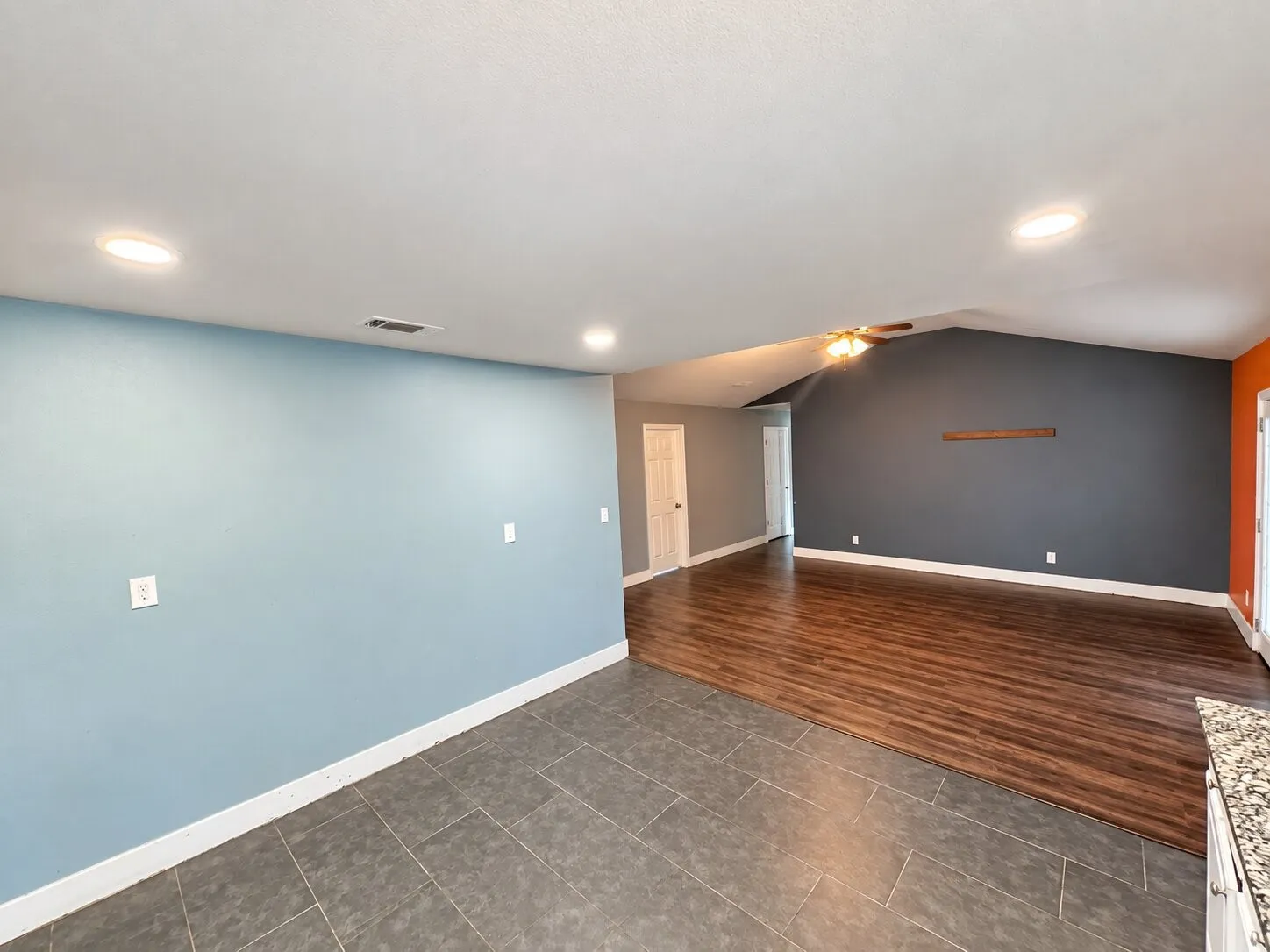 Recessed lighting, vaulted ceiling, wood-finish flooring, tile flooring, and ceiling fan
