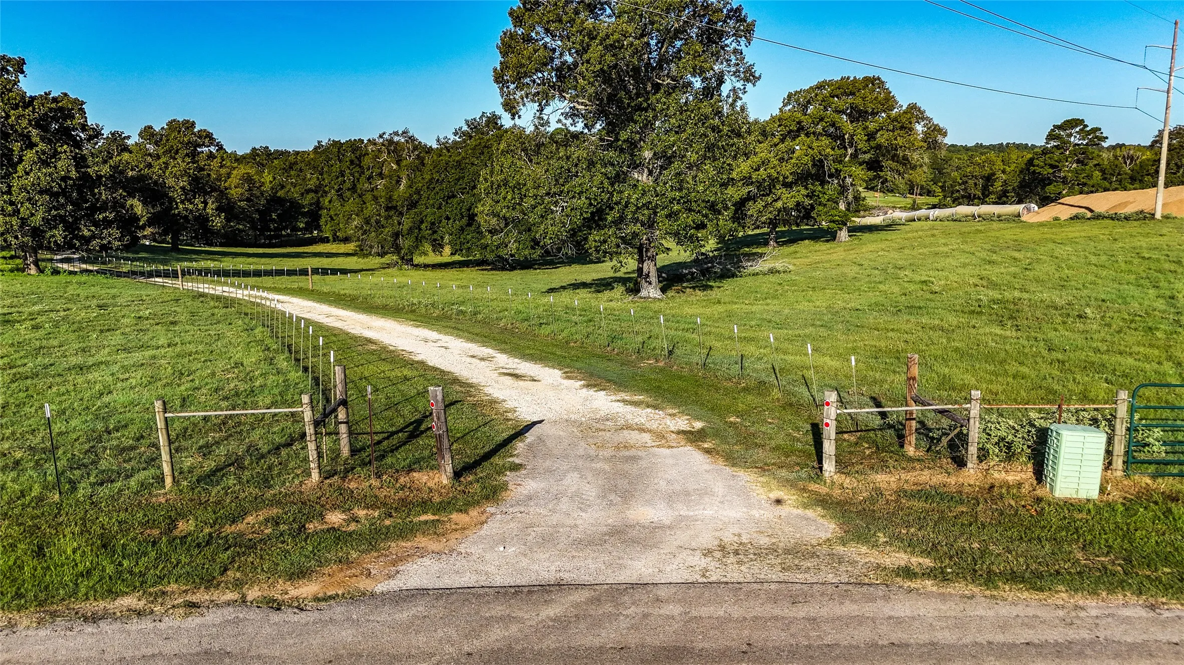 Gravel drive with perimeter fencing