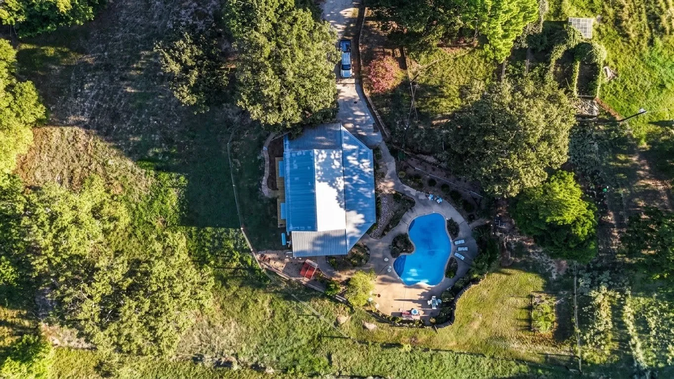 Outdoor swimming pool with surrounding hardscaping