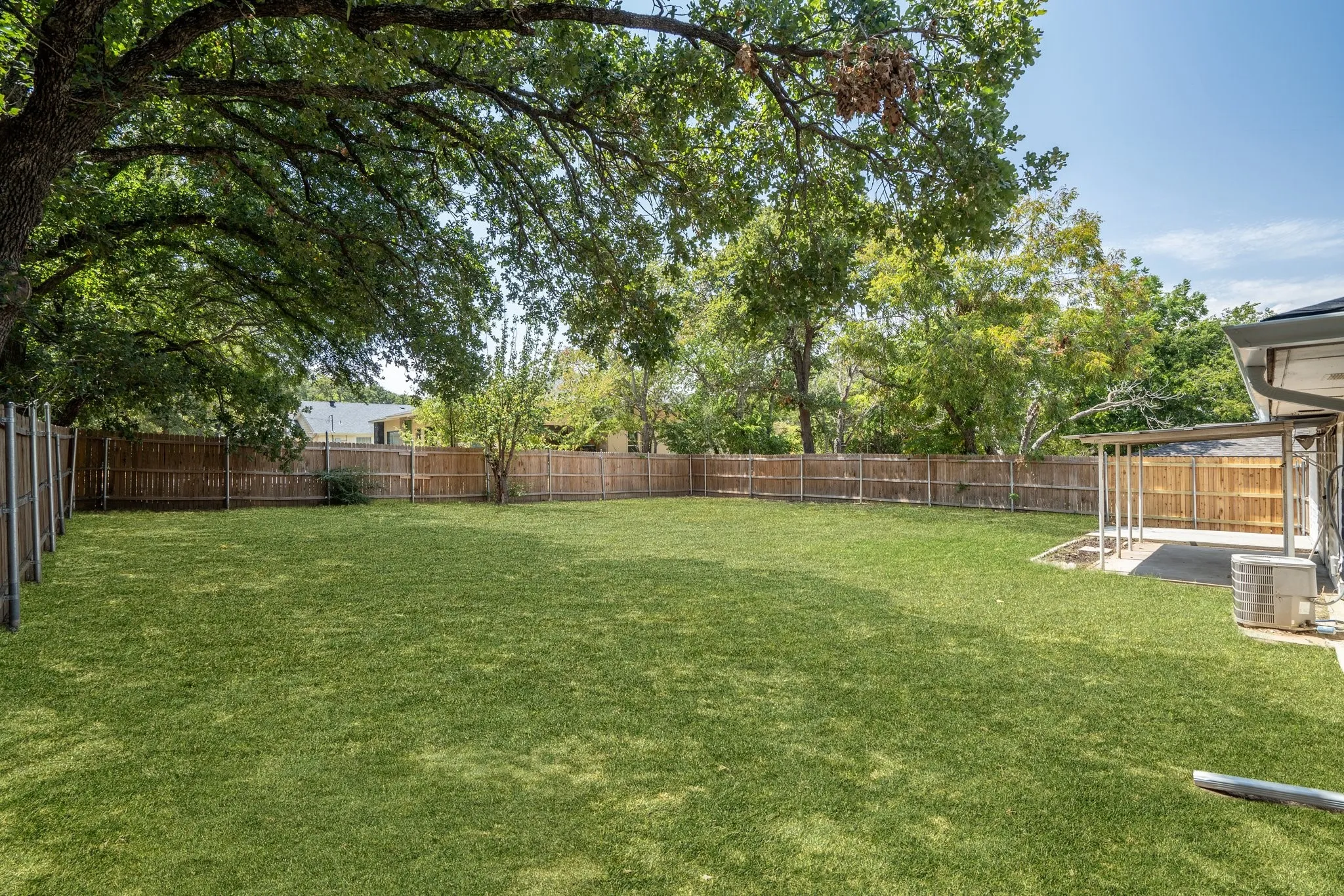 View of yard with a patio and central air condition unit