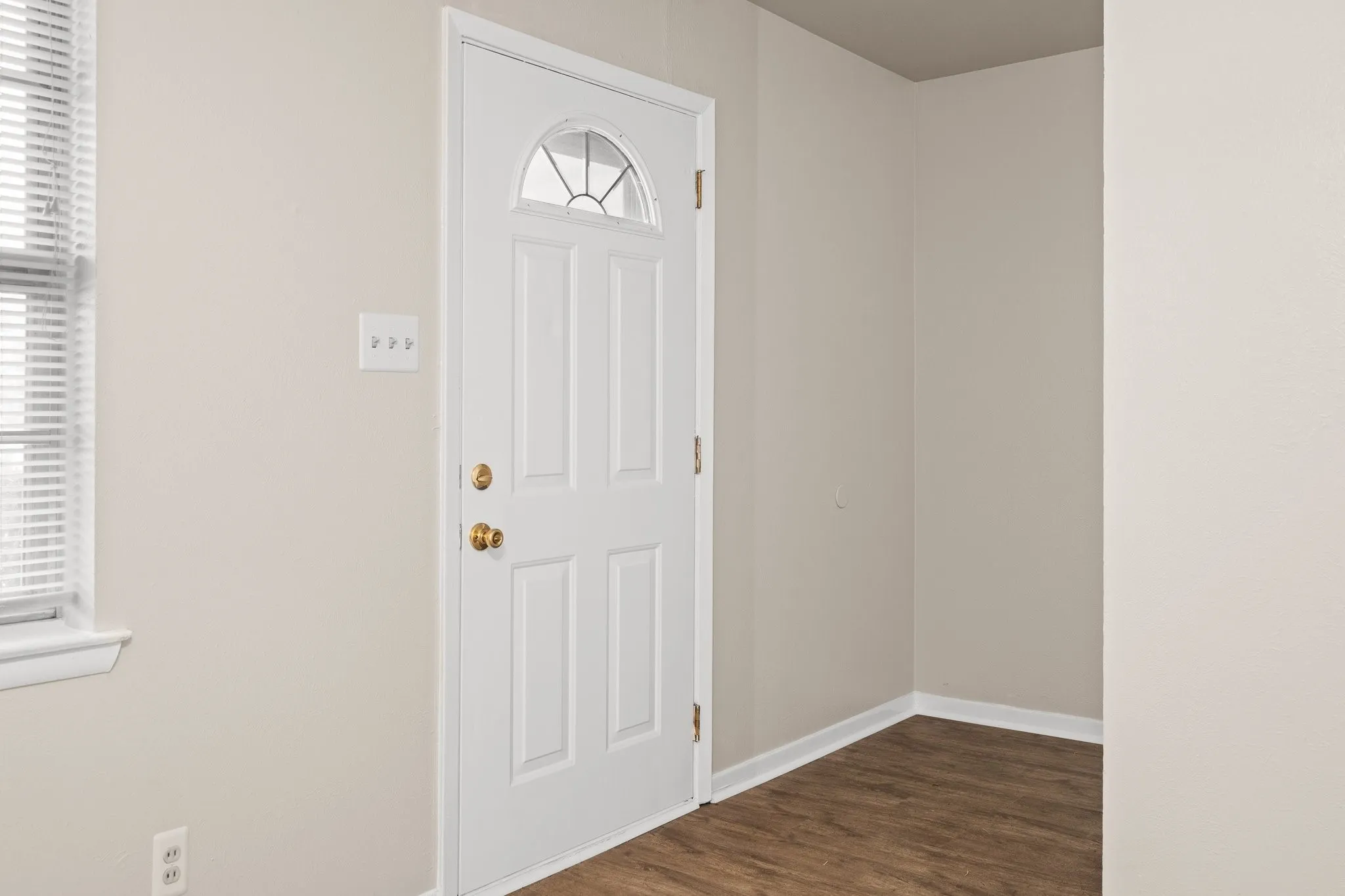 Entryway featuring dark wood-type flooring