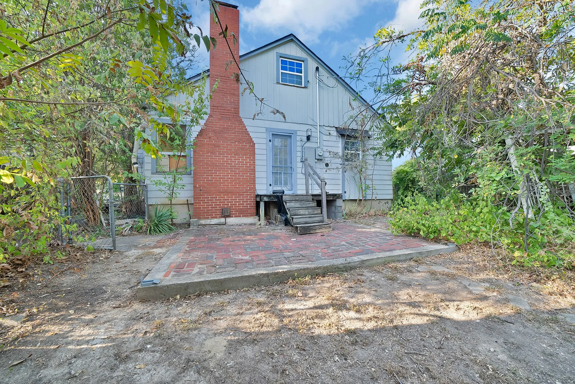Exterior siding with brick chimney