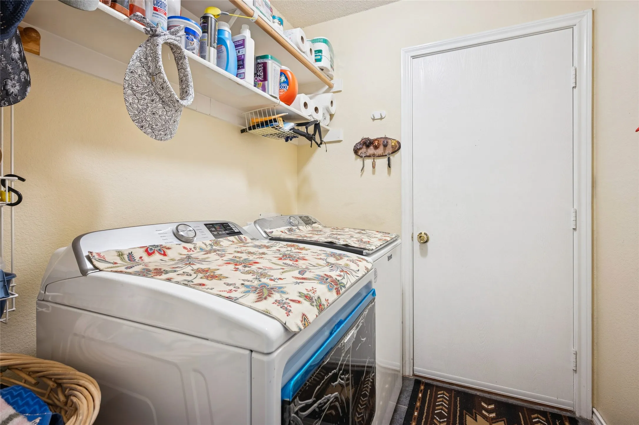  Laundry room with storage area