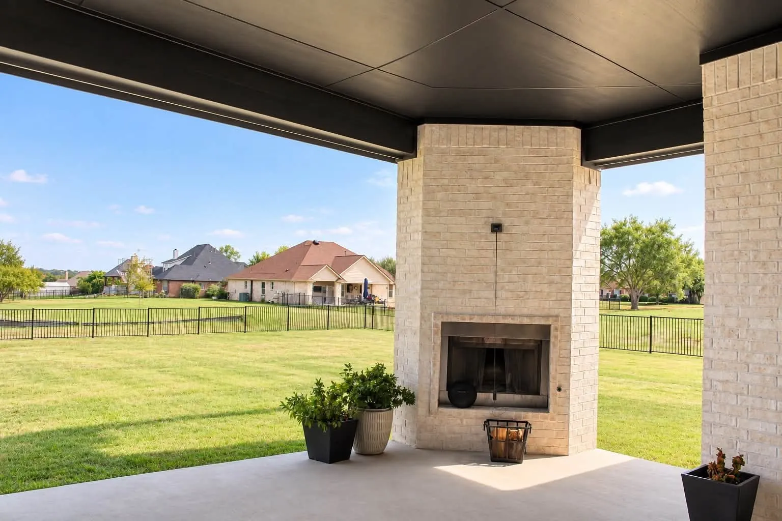 Wood burning fireplace on extended back patio.