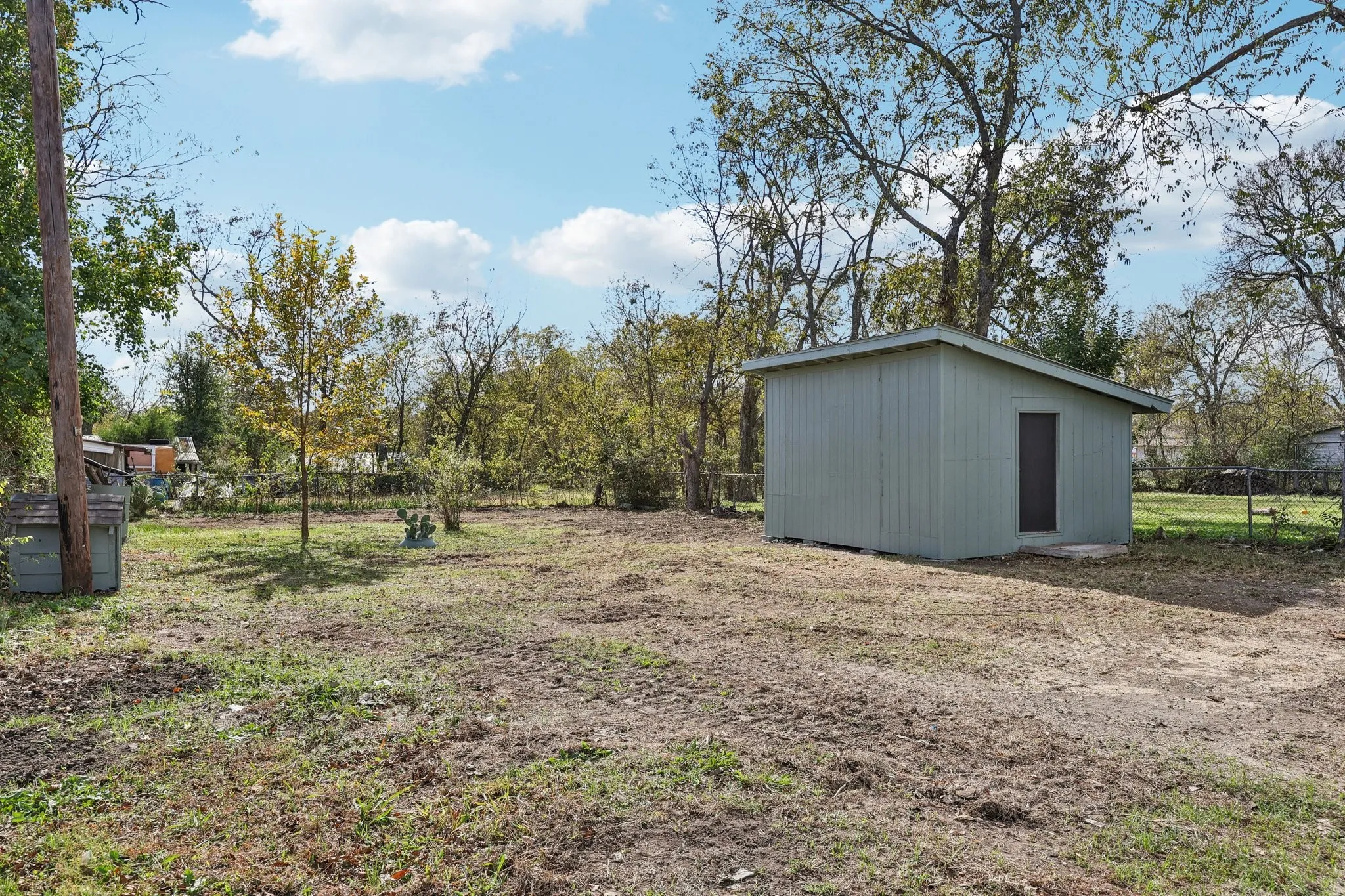 Freestanding storage shed featuring a single entry door and a pitched roof
