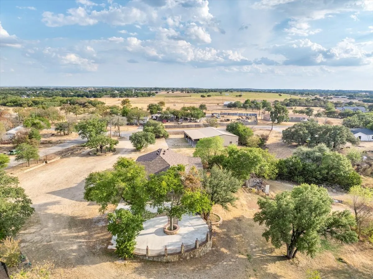 Northern aerial view of 3601 Oak Cir, Weatherford, TX -76088; 3664 sq ft on 2.92 acres with a 2600 sq ft workshop