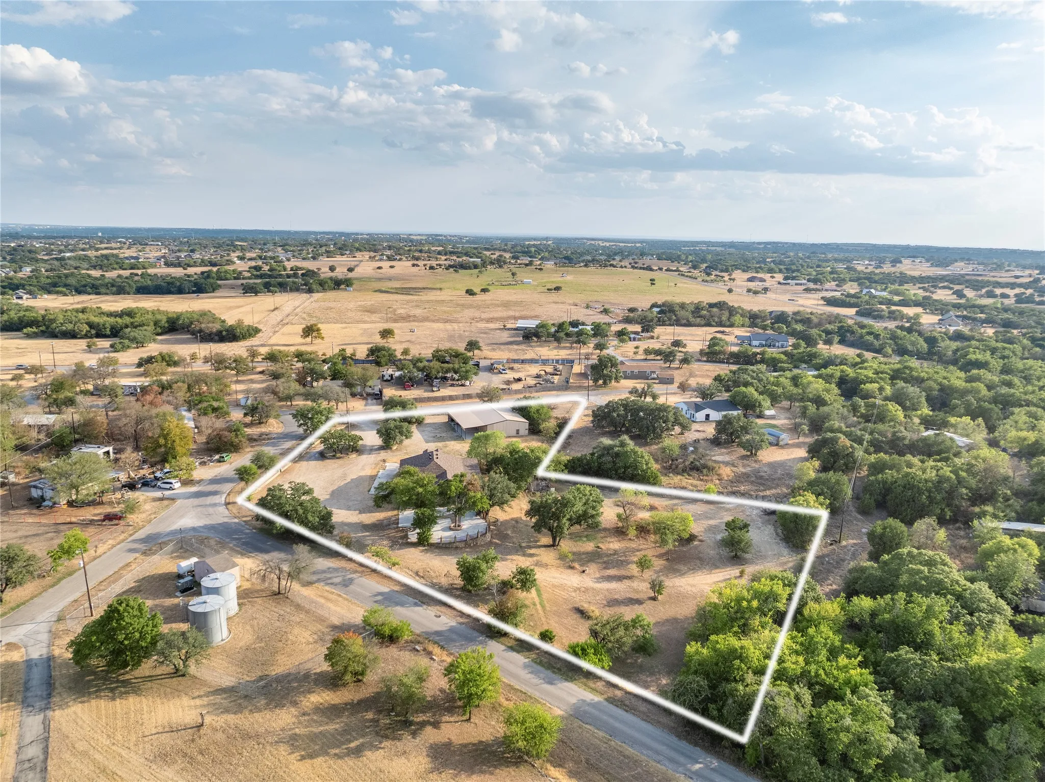 Northern aerial view of 3601 Oak Cir, Weatherford, TX 76088 - 3664 sq ft on 2.92 acres with a 2600 sq ft workshop
