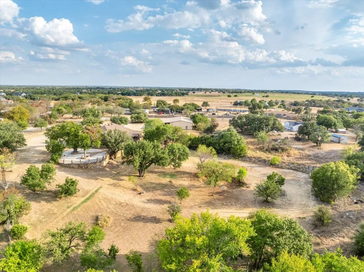 3601 Oak Cir, Weatherford, TX -76088; 3664 sq ft on 2.92 acres with a 2600 sq ft workshop