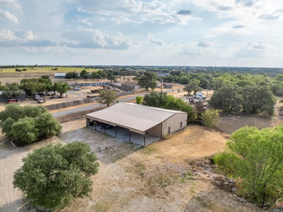View of the 2600 sq ft workshop from the east at 3601 Oak Cir, Weatherford, TX 76088 - 3664 sq ft on 2.92 acres