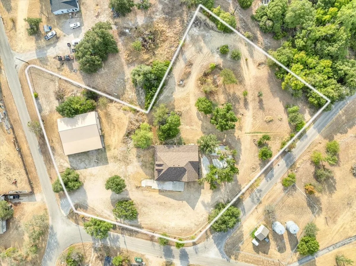 Aerial view of 3601 Oak Cir, Weatherford, TX 76088 - 3664 sq ft on 2.92 acres with a 2600 sq ft workshop