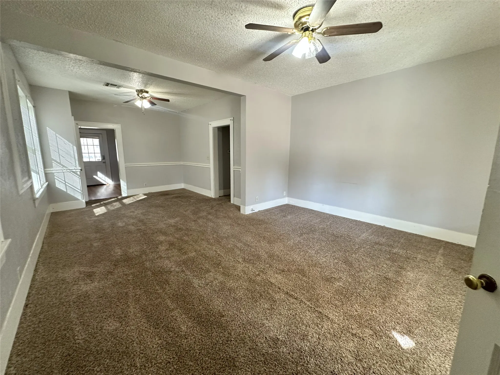 Neutral wall paint, plush carpet, and great natural light