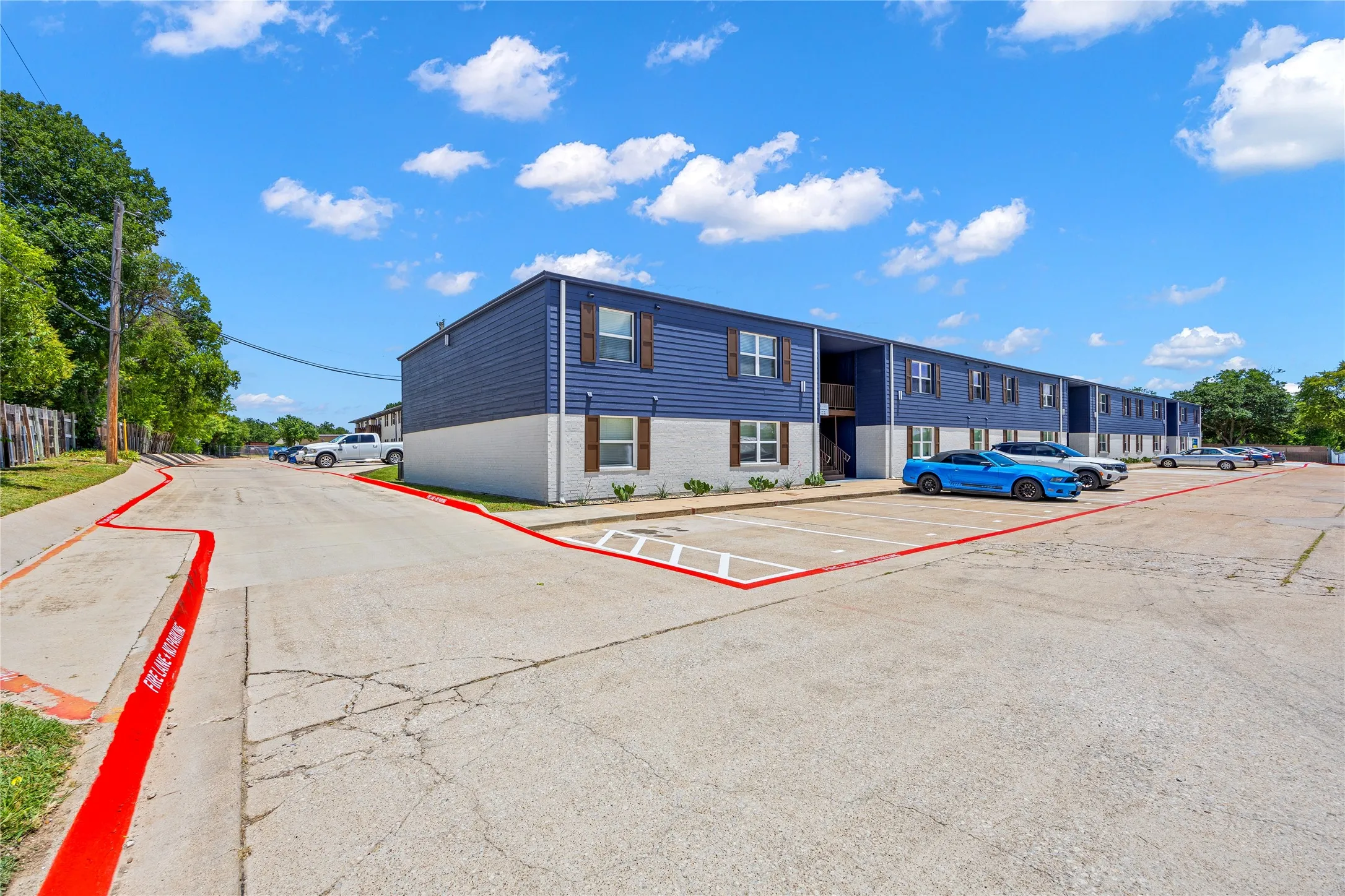 View of property with uncovered parking