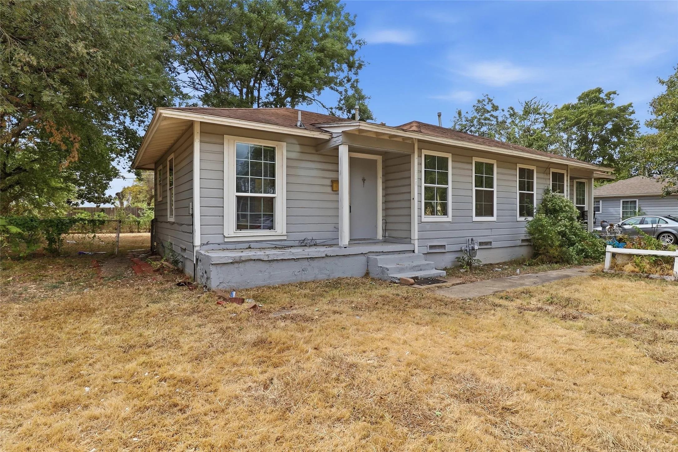 Light gray siding exterior with multiple windows
