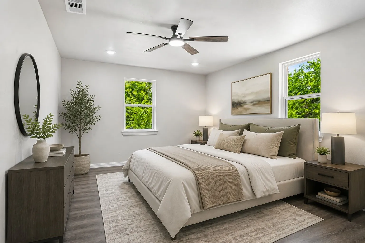 Spacious room featuring wood-finish flooring, a contemporary ceiling fan, recessed lighting, and dual windows