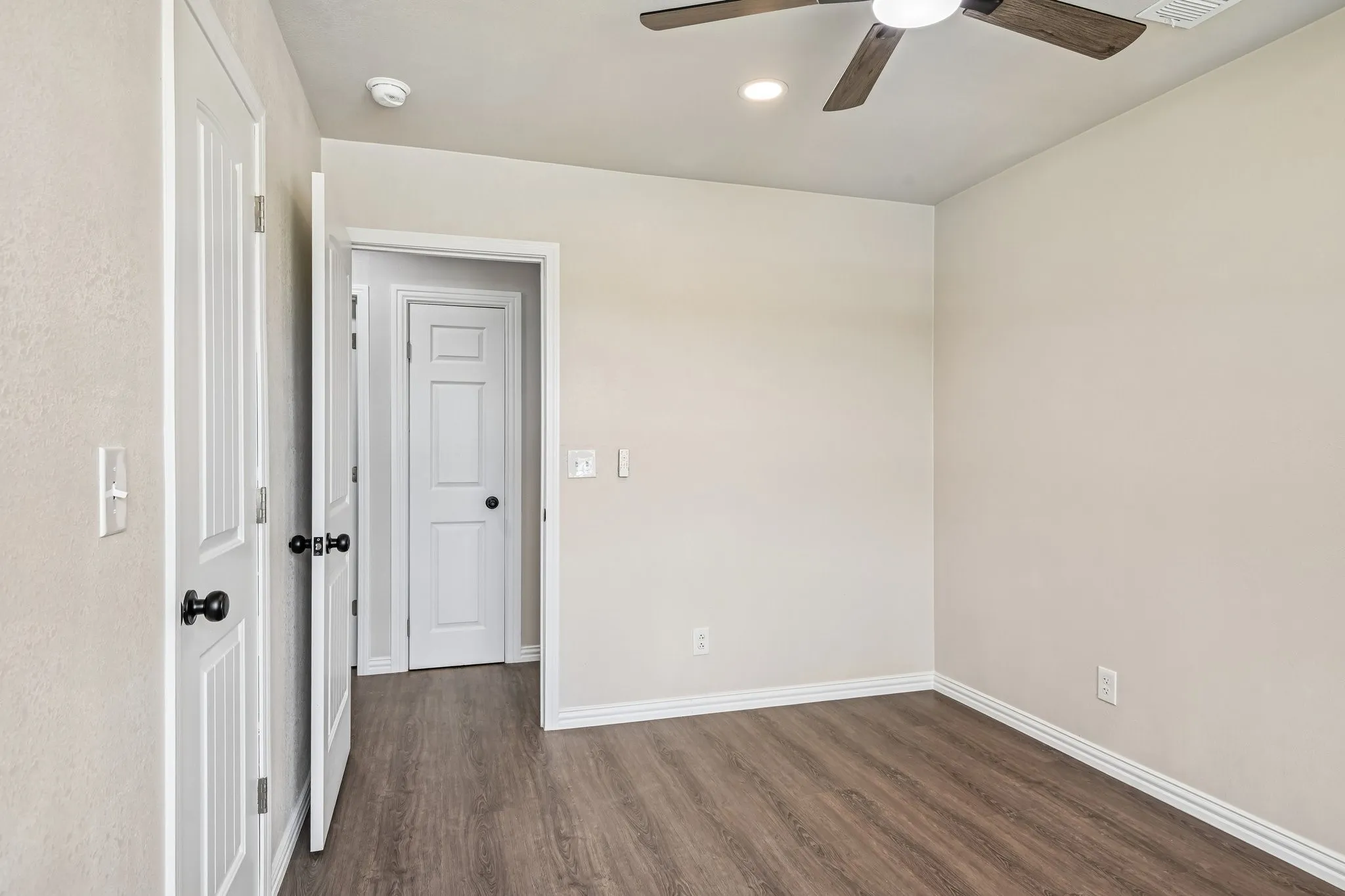 Interior space featuring wood-finish flooring and light-toned walls
