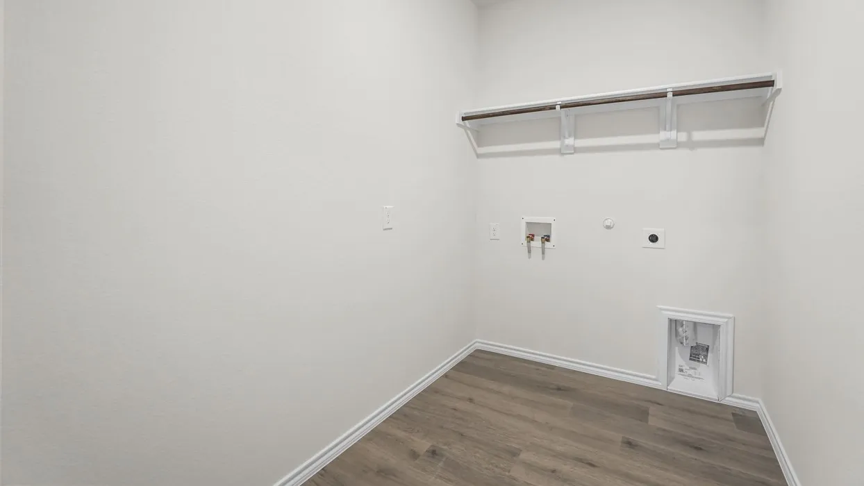 White walls, wood-finish flooring, and built-in shelving