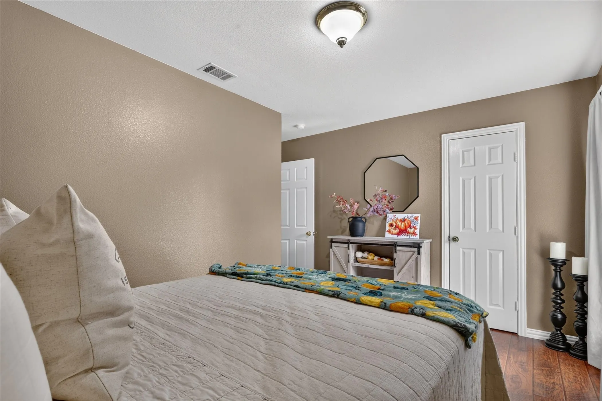 Wood-finish flooring with neutral wall tones and white trim