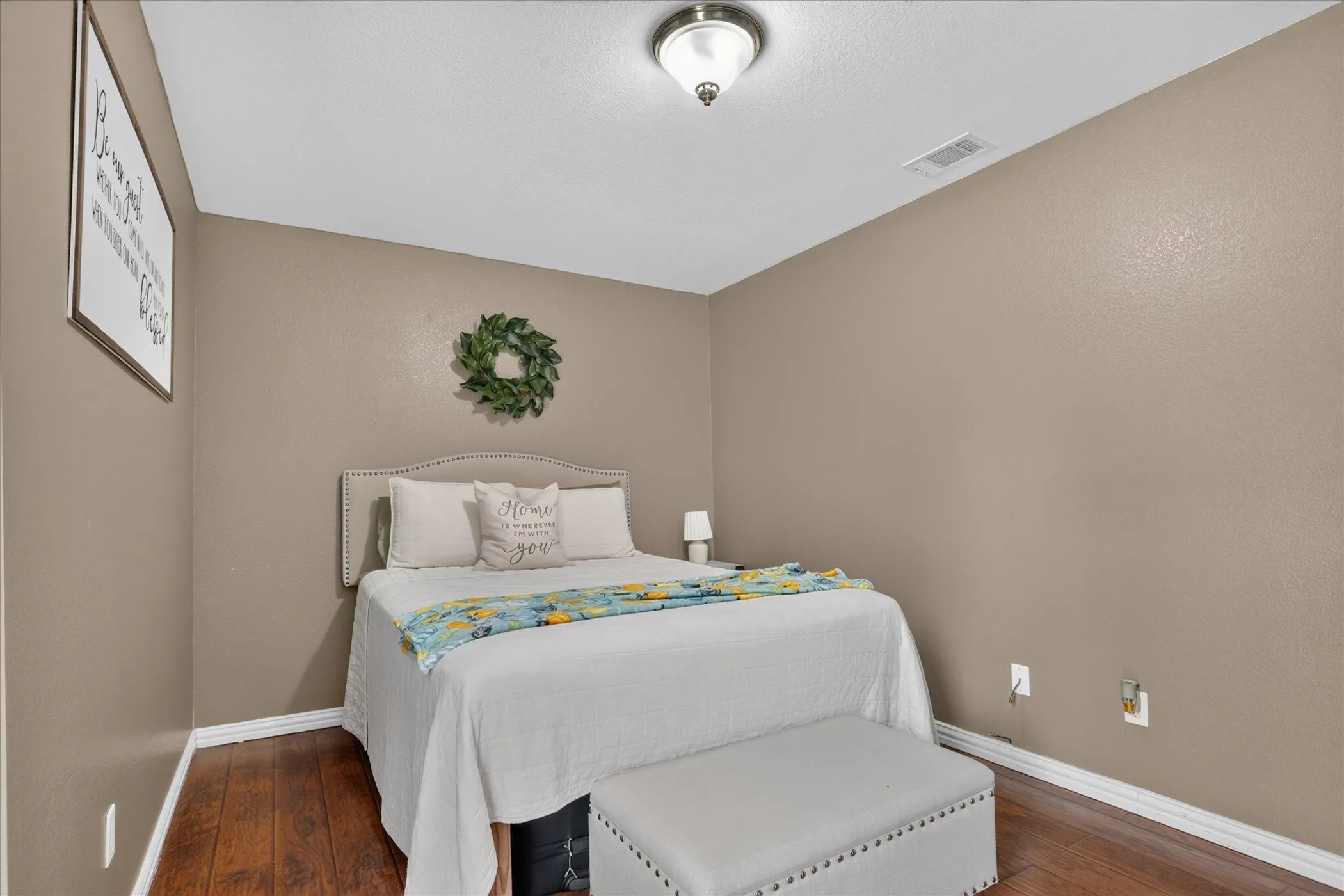 Wood-finish flooring with white trim and neutral wall tones