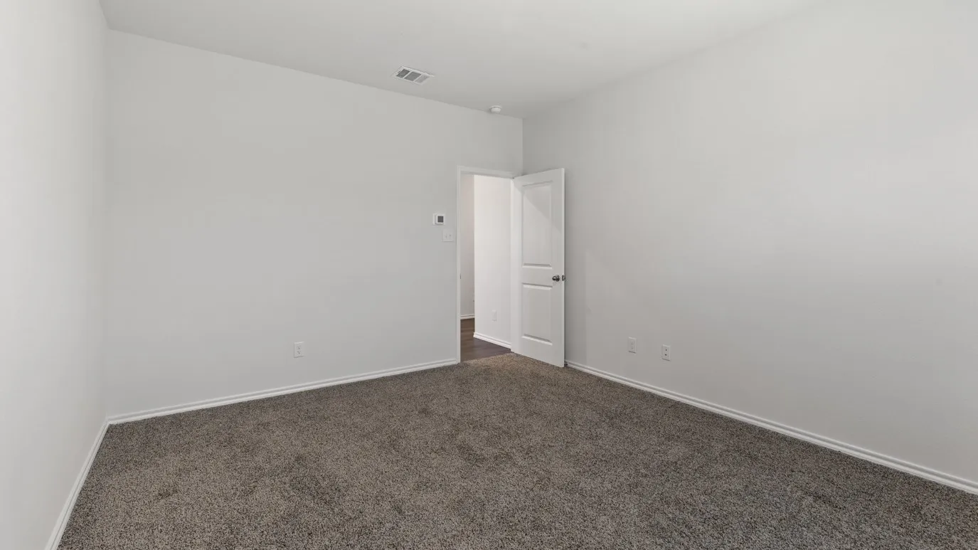 Neutral wall tones with a textured carpeted floor