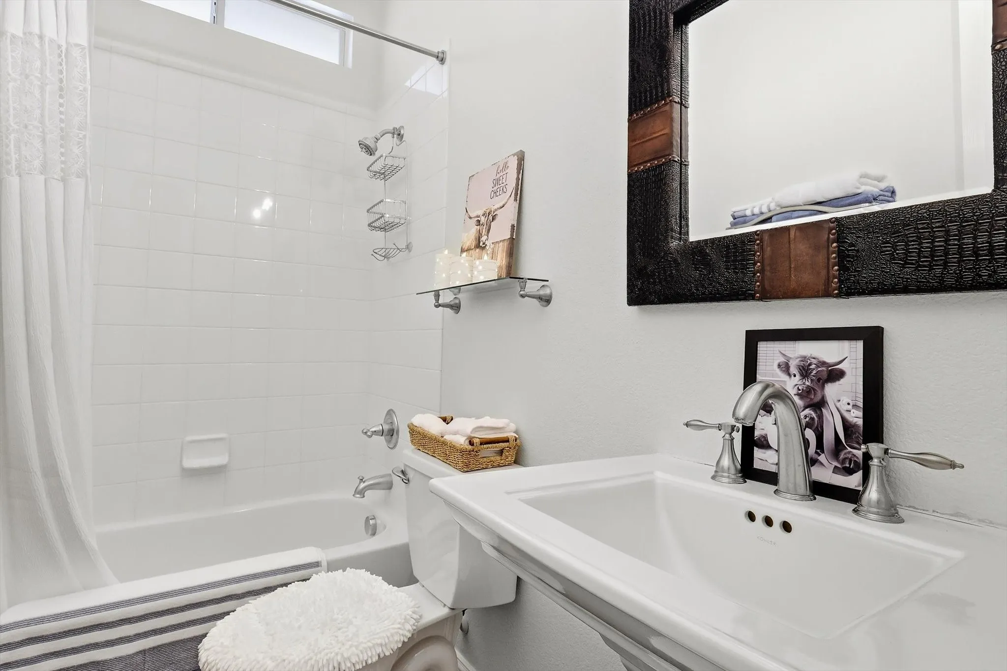 The secondary full bathroom offers a convenient tub and shower combination.