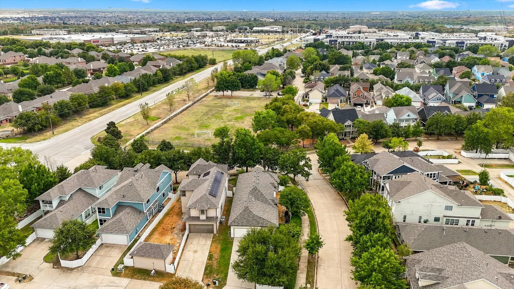 A bird’s-eye view showcases the corner-lot setting and surrounding Savannah neighborhood.