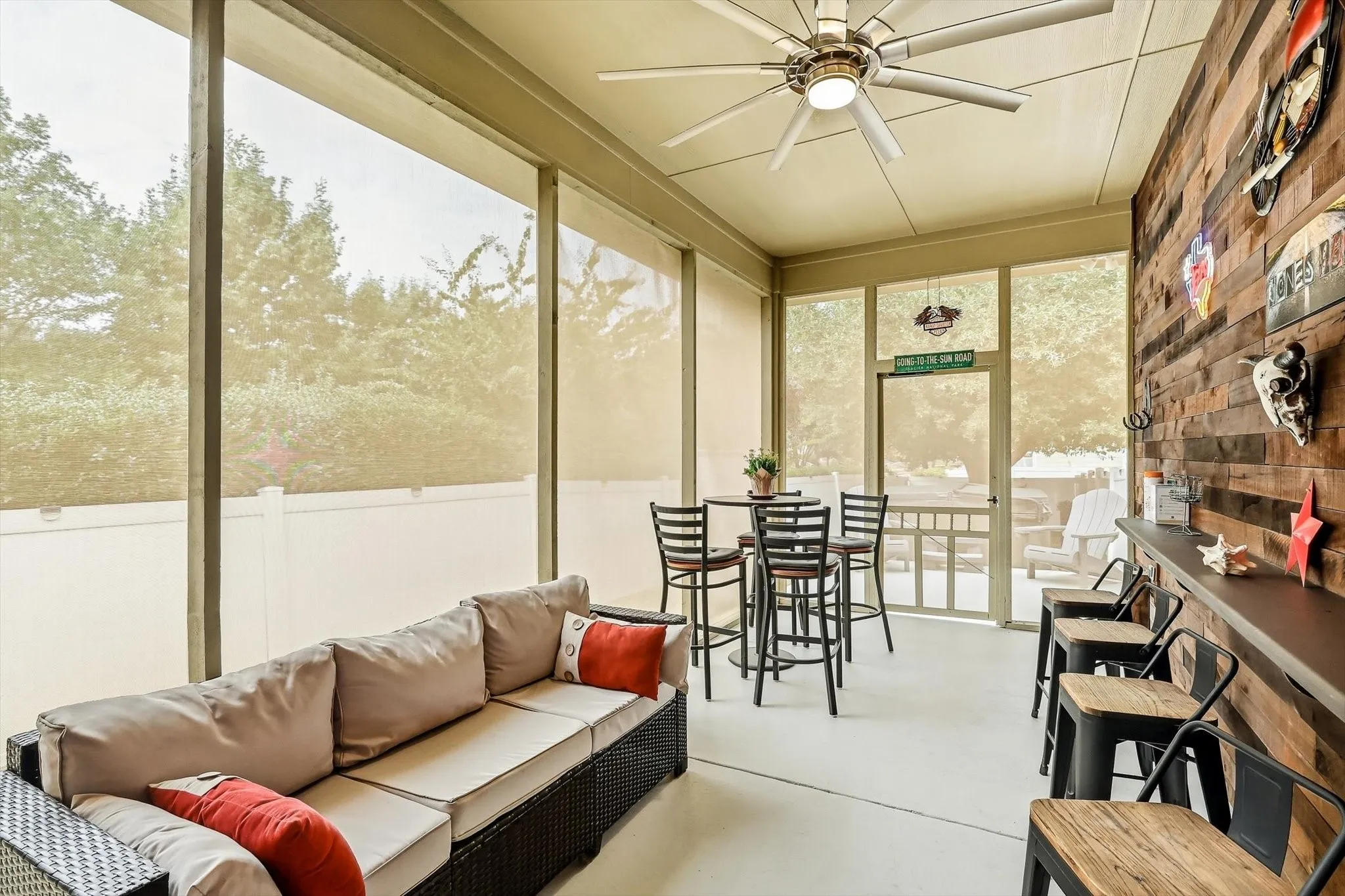 Lounge, dine, or linger over conversation on the screened back patio, upgraded with a new concrete foundation and extended roof.