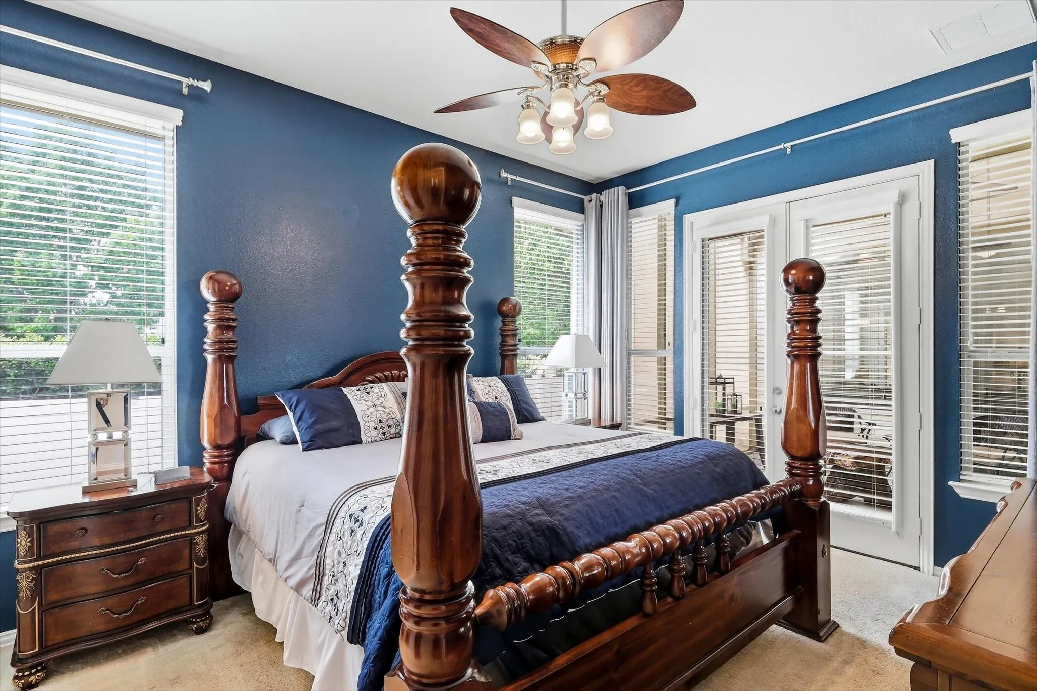 Retreat to the primary bedroom, with direct access to the screened patio for a quiet start or finish to your day.