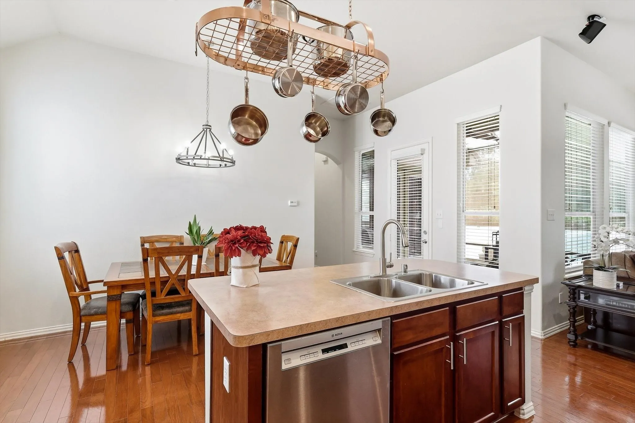 A generous island with sink and dishwasher keeps everyday preparation and cleanup conveniently within reach.
