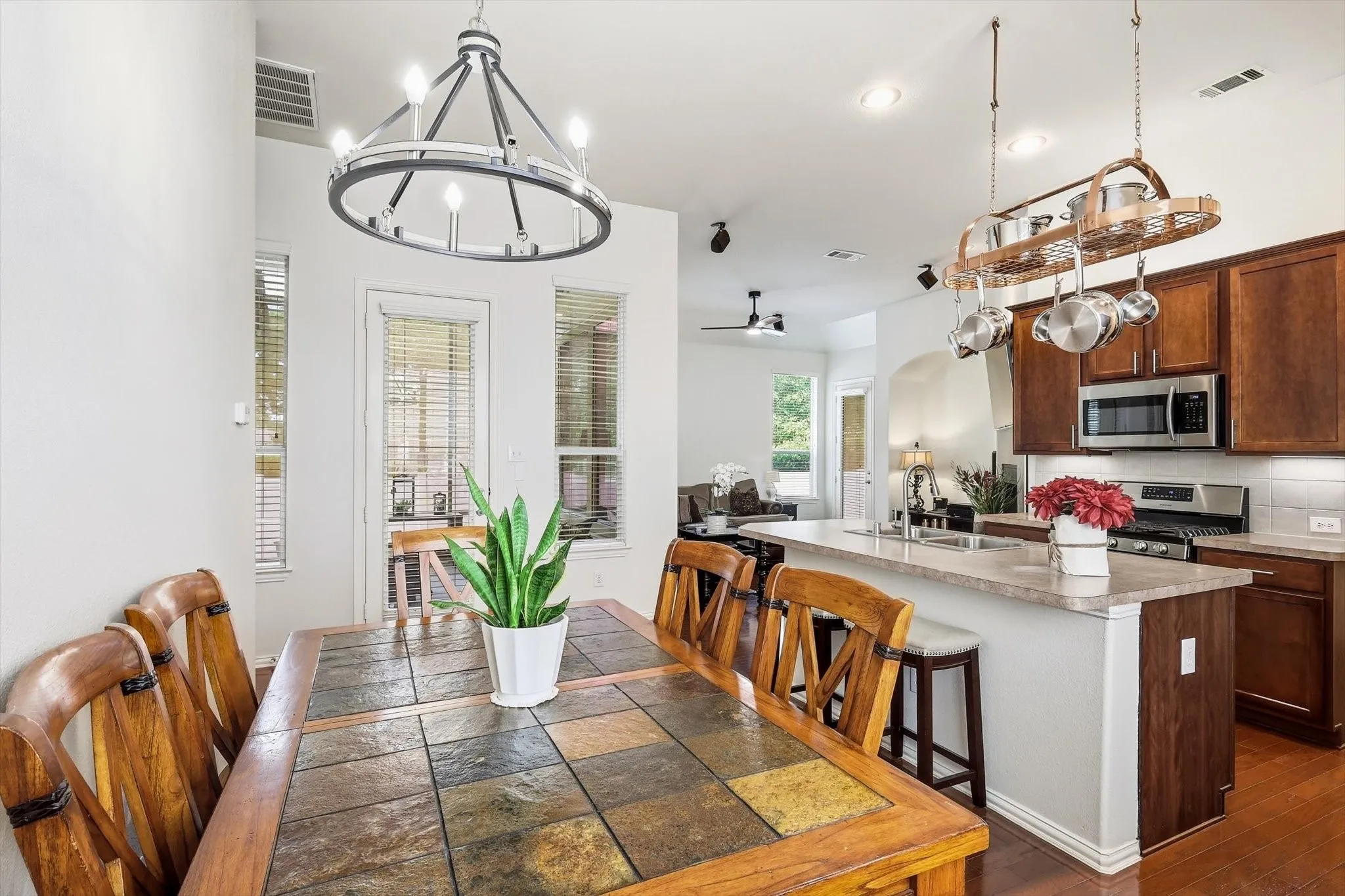 From morning coffee to dinner with friends, the open kitchen and dining area keep everyone connected.