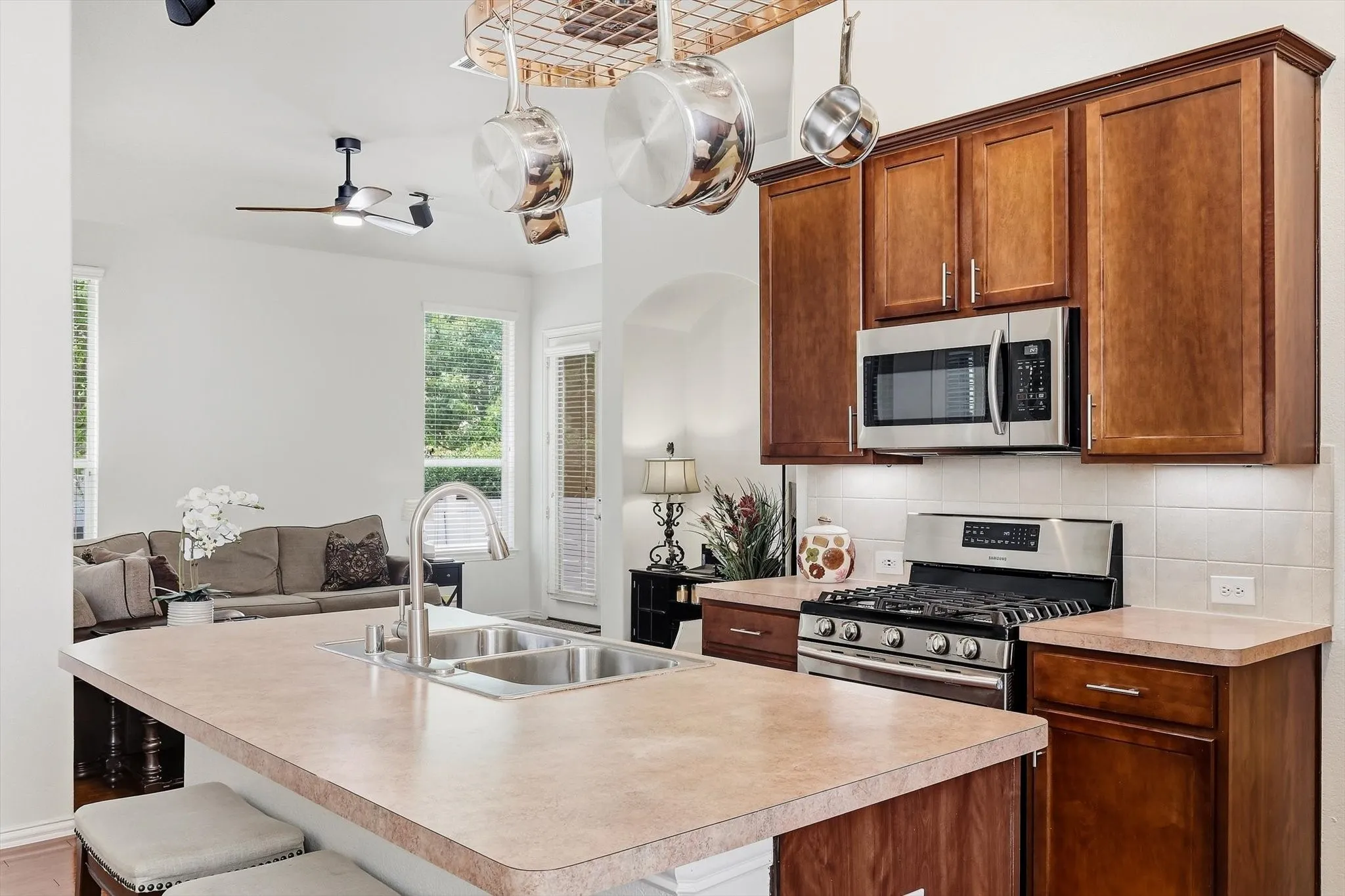 Prepare a favorite meal while staying part of the conversation in the adjoining family room.