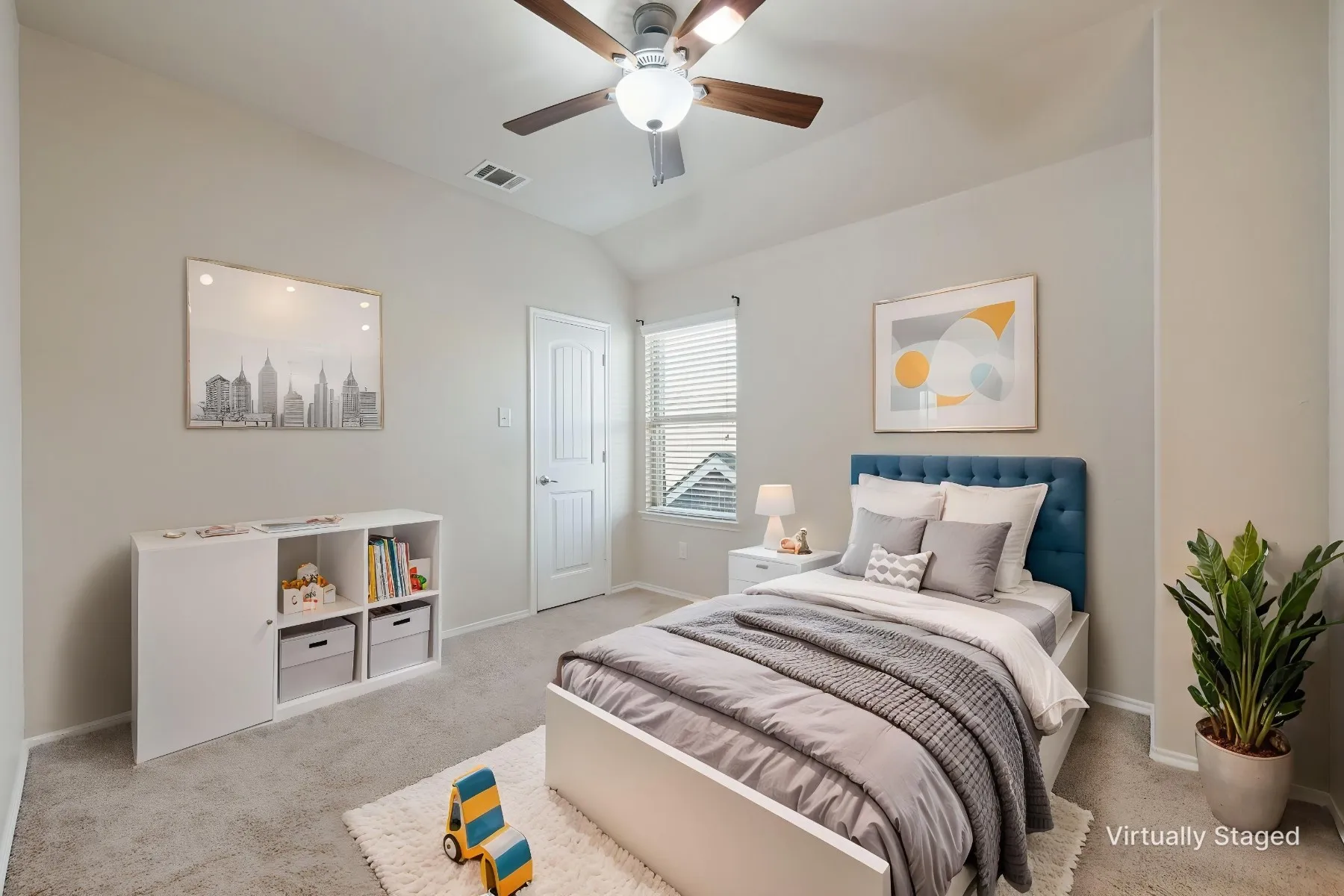 Carpeted bedroom featuring a vaulted ceiling with a ceiling fan, a window with blinds, and a white paneled door