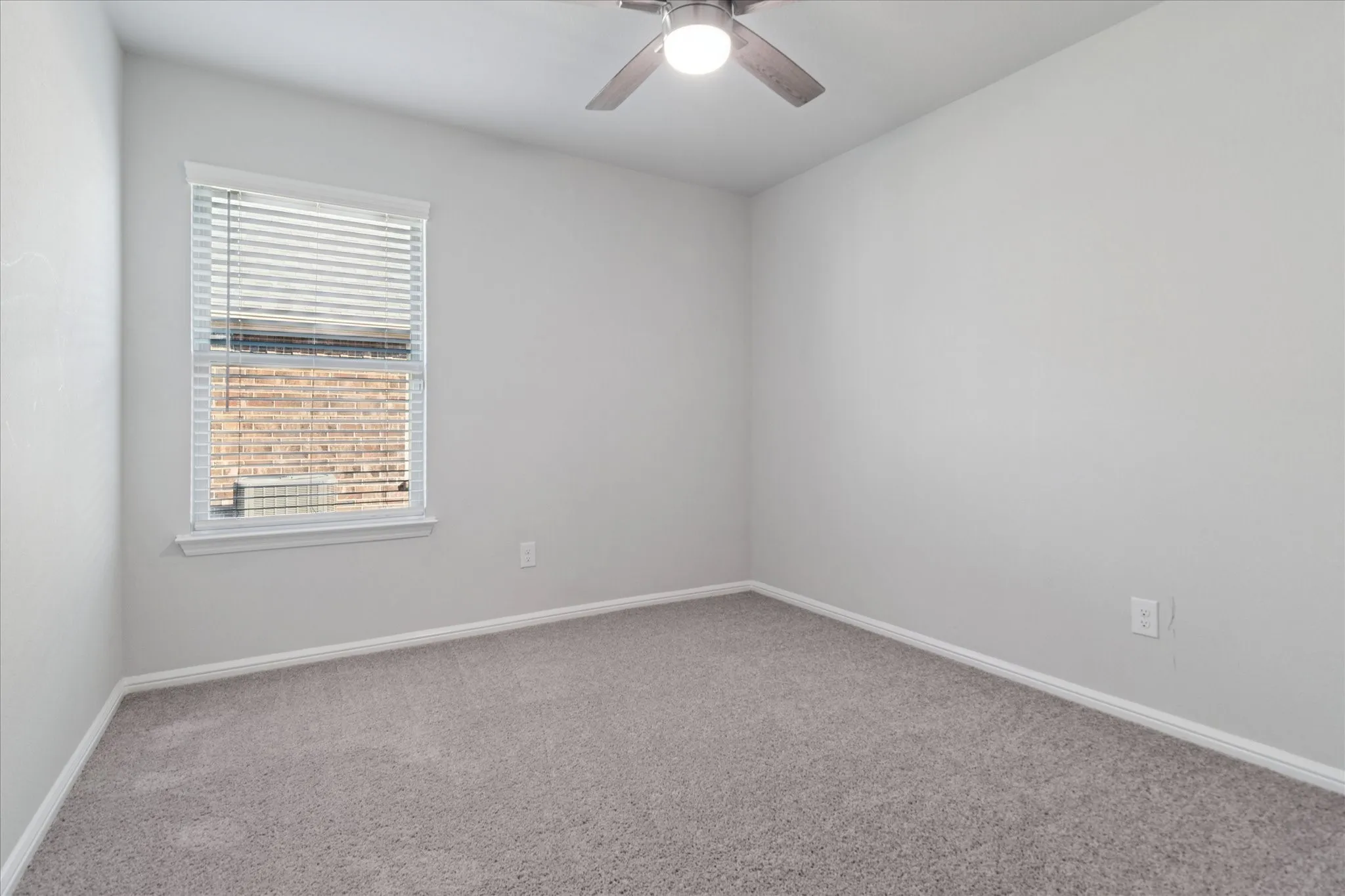 Neutral-toned carpeting paired with light wall finishes