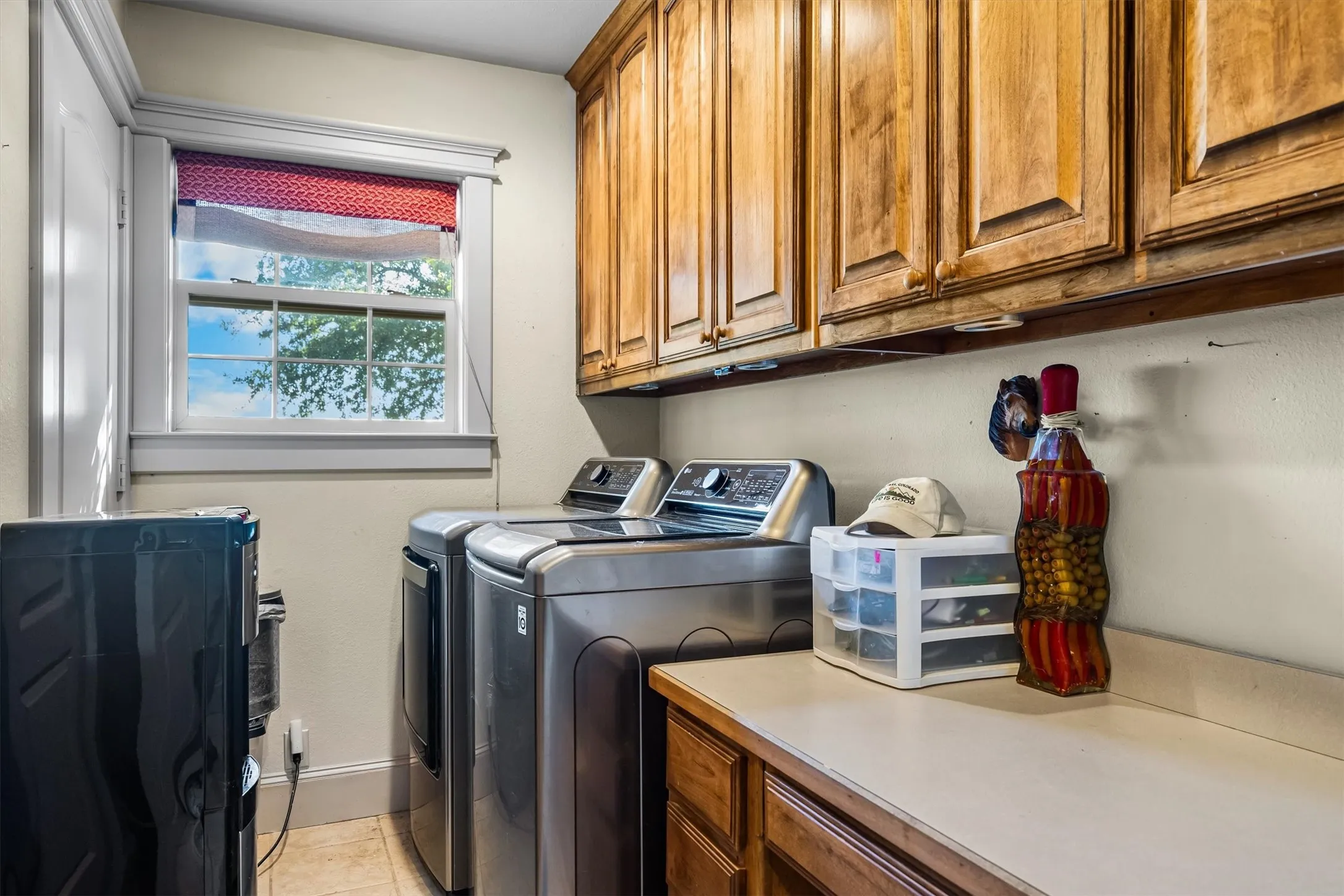 In the floorplan you will see 2 closets. One is the water heater and the other is for storage. The 3rd closet shown is actually the pantry cabinet that does not open into the laundry room