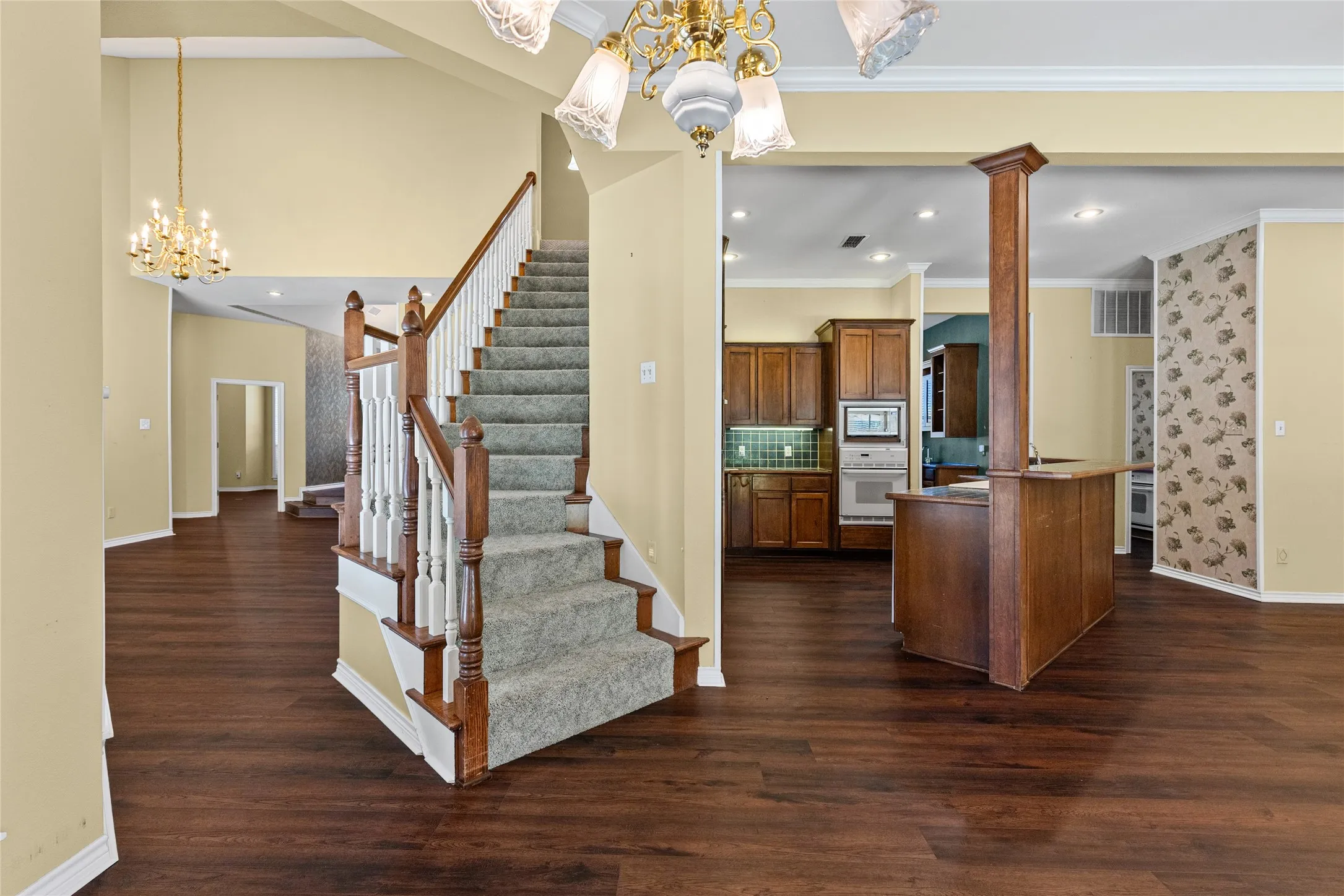View of kitchen and stairs to second floor.