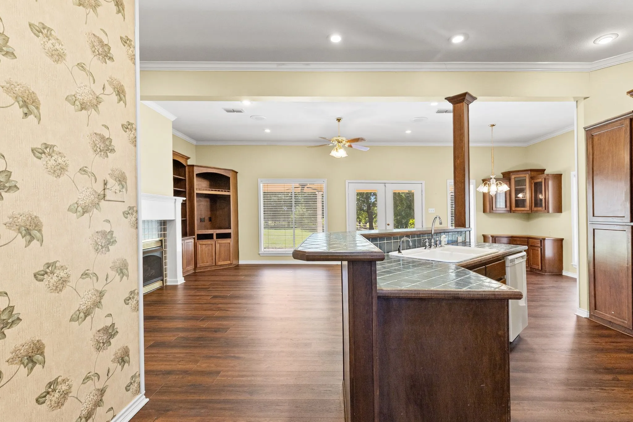 Another view of island; breakfast room built-ins are visible in the back right corner. Huge pantry just around the corner.