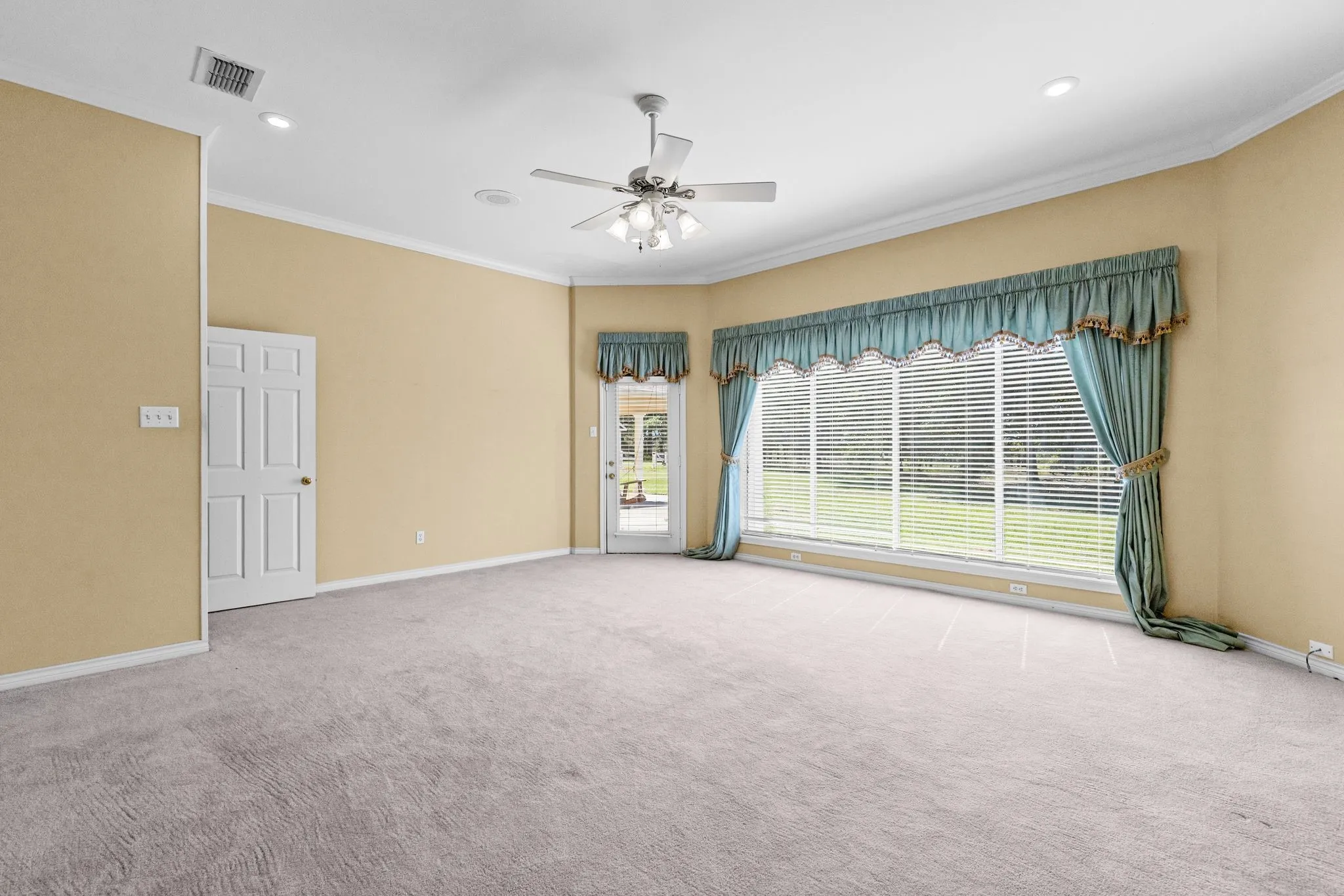 Primary suite on main floor; has triple window, separate entrance to back porch.