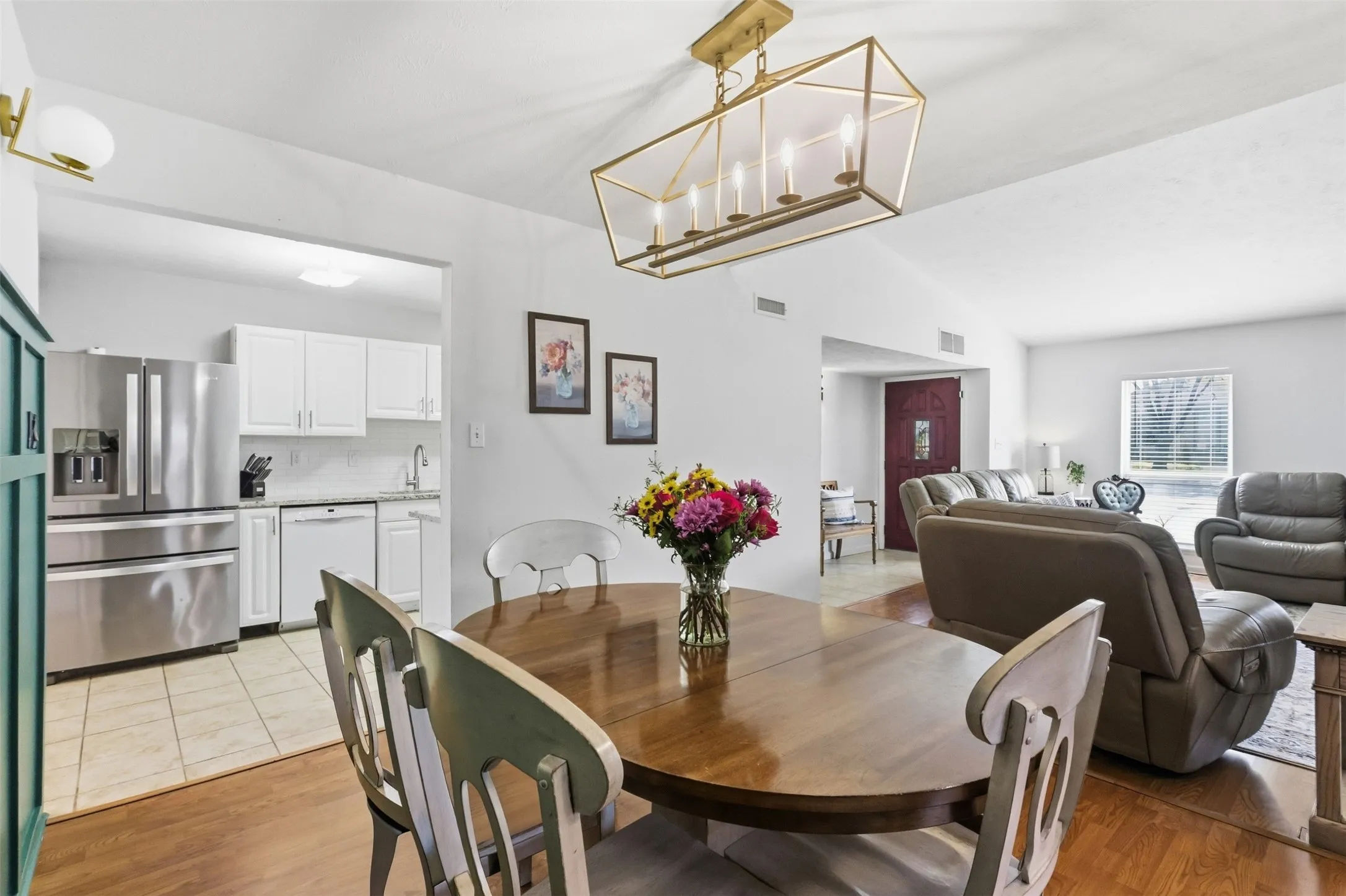 Another view of the dining area showing the open layout and flow into the surrounding spaces.